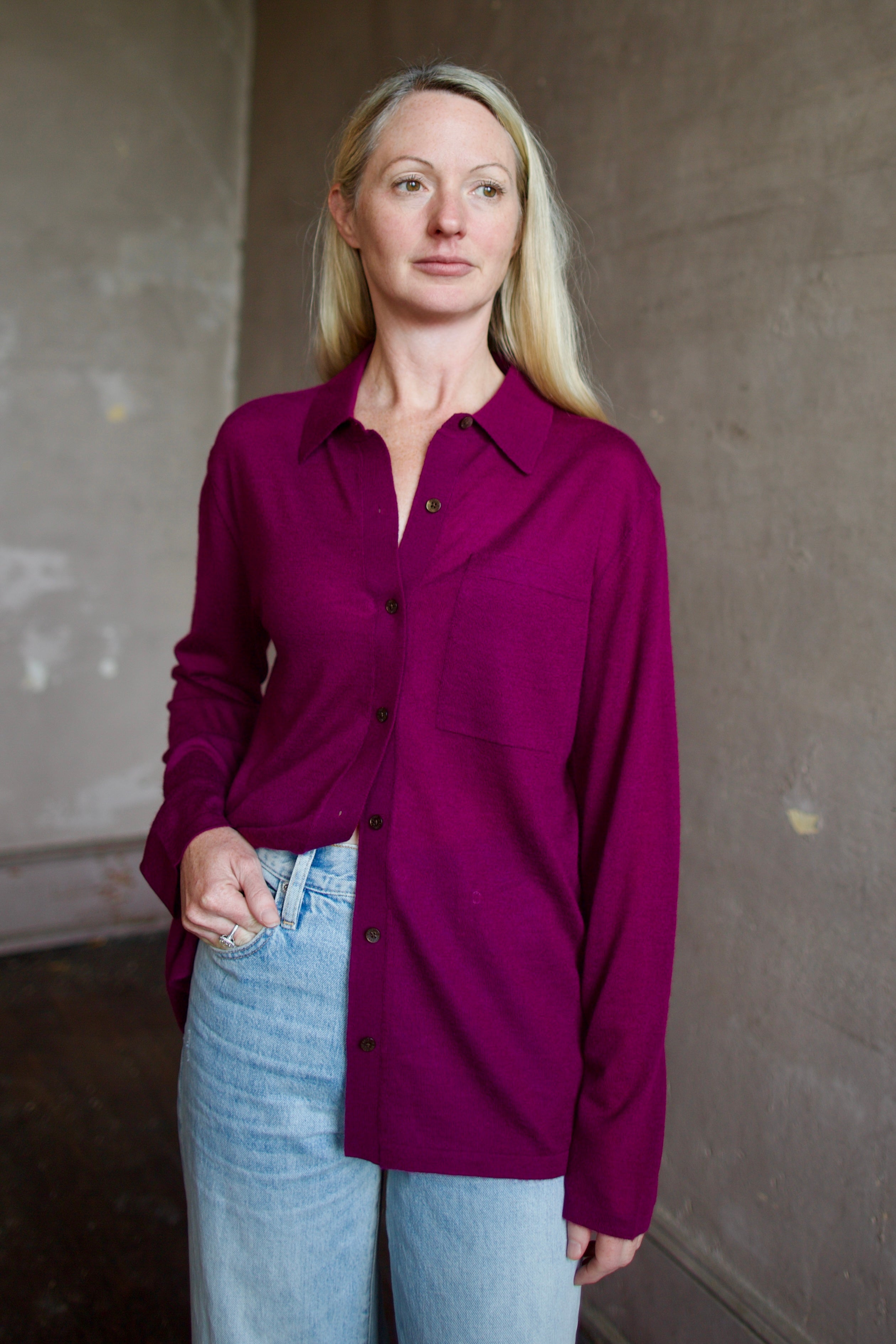 Model wearing the designer Guest In Residence Showtime shirt in Aubergine button up premium cashmere long sleeve shacket 