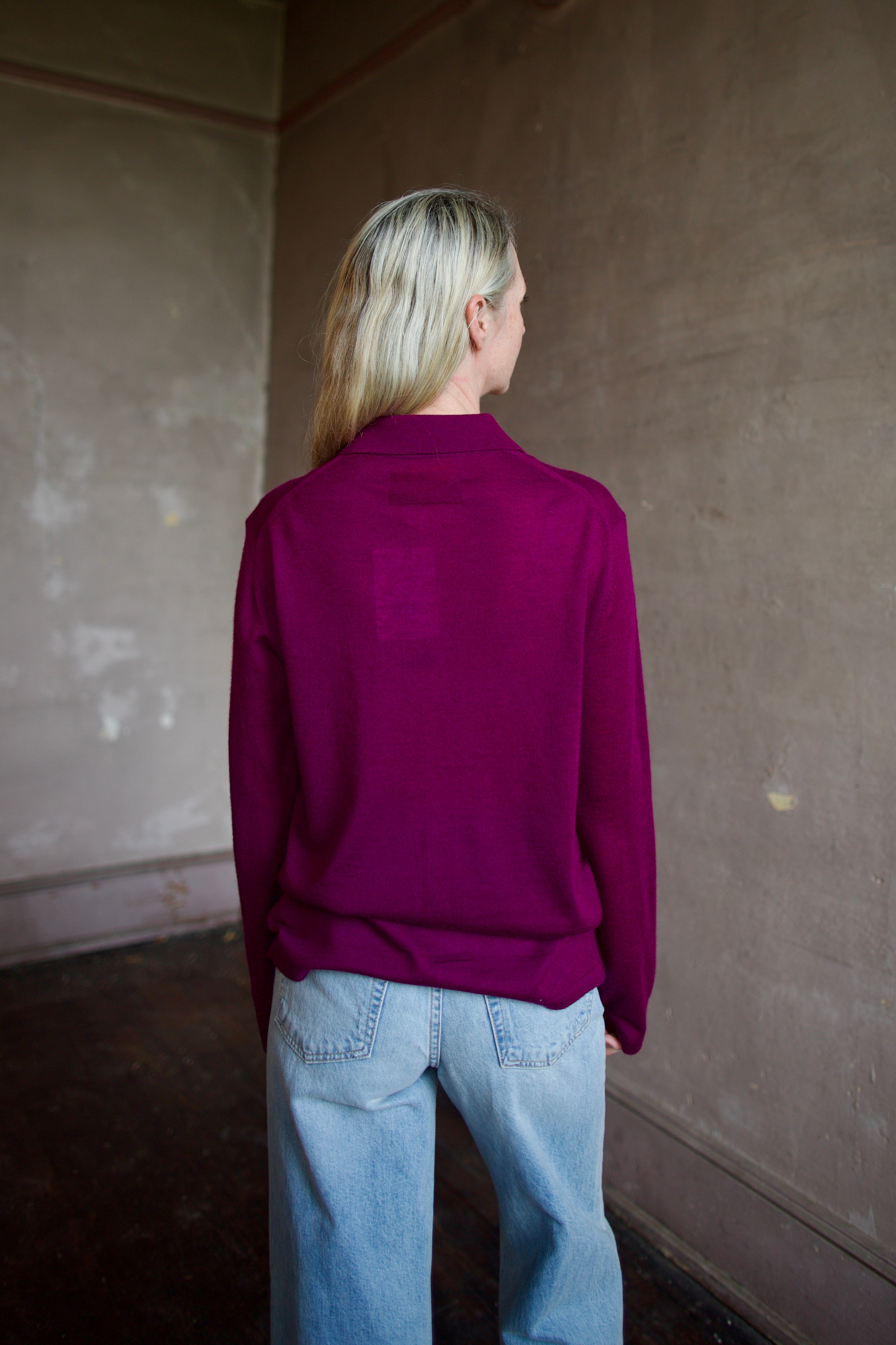 Model wearing the designer Guest In Residence Showtime shirt in Aubergine button up premium cashmere long sleeve shacket 