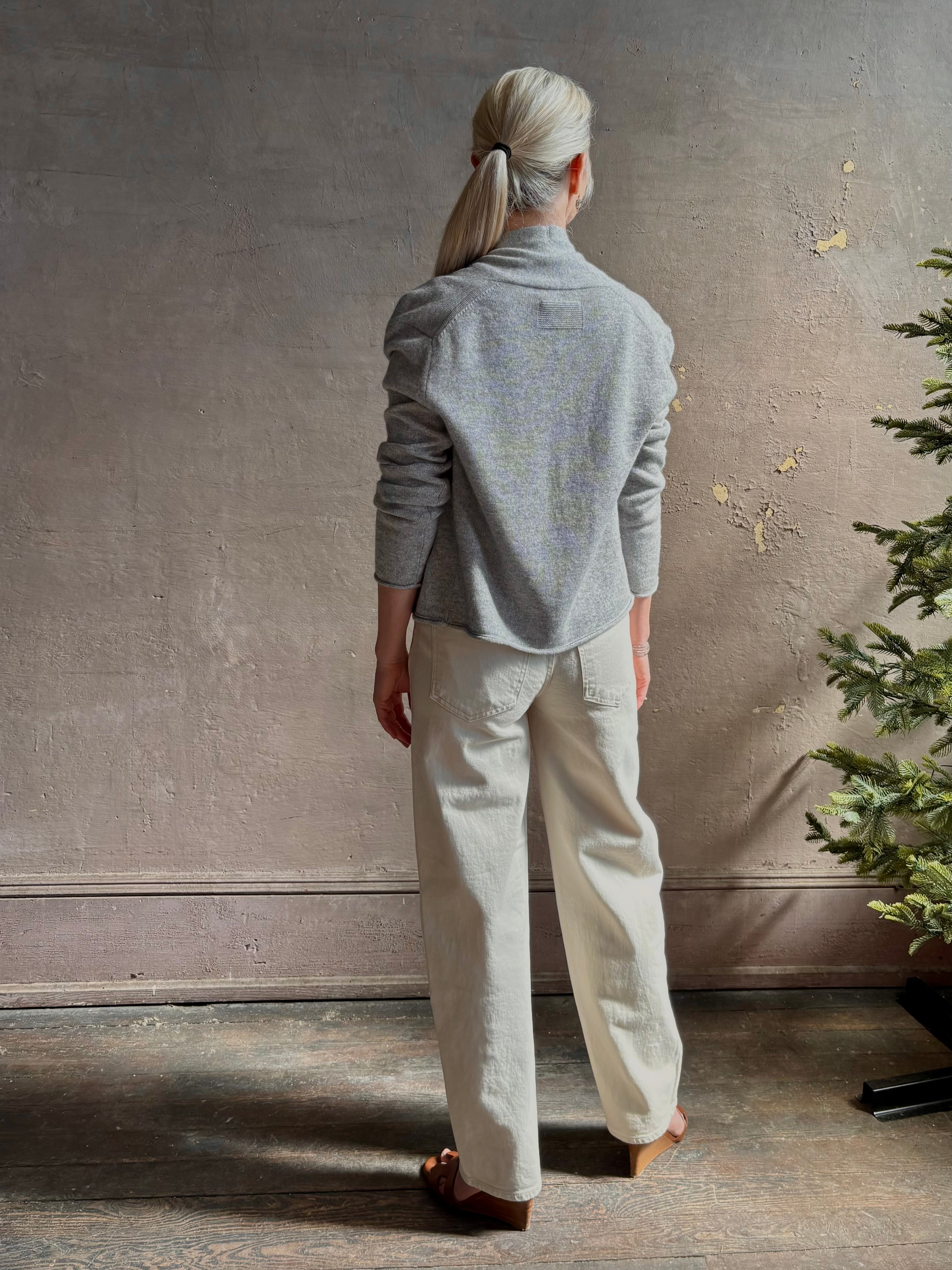 Mature woman wearing comfortable stone grey cashmere linen GUEST IN RESIDENCE Stealth long sleeve crop Cardigan with single hook and eye front closure crafted in a neutral stone grey