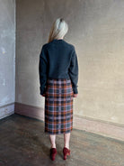 Mature woman wearing Guest in Residence Tartan Wrap Skirt in Sprinkle Combo wool-cashmere midi pencil silhouette and fringe trim