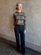 Image of woman wearing premium brushed cashmere crew neck sweater from Guest in Residence in brown and charcoal grey stripe 