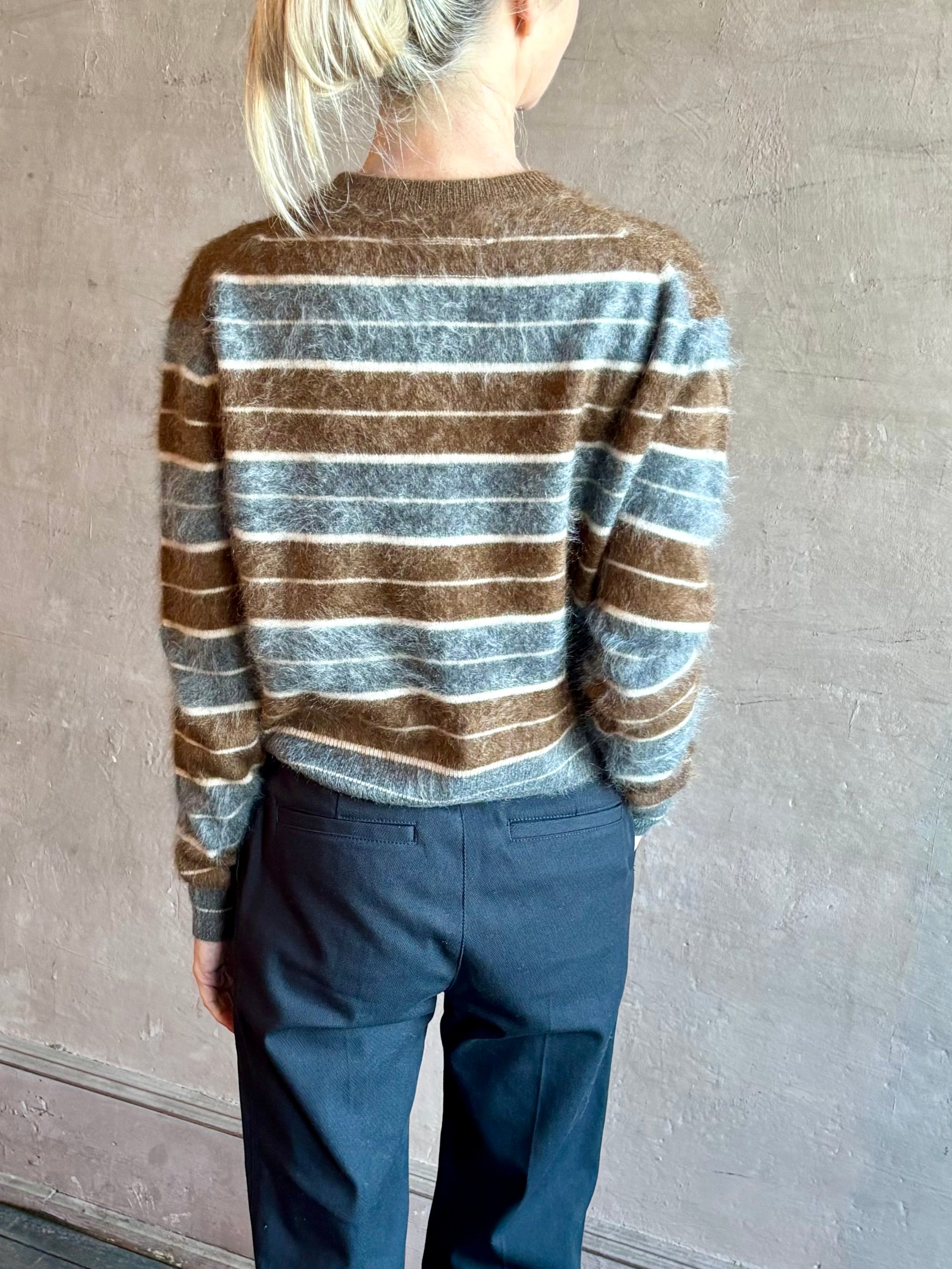 Image of woman wearing premium brushed cashmere crew neck sweater from Guest in Residence in brown and charcoal grey stripe 