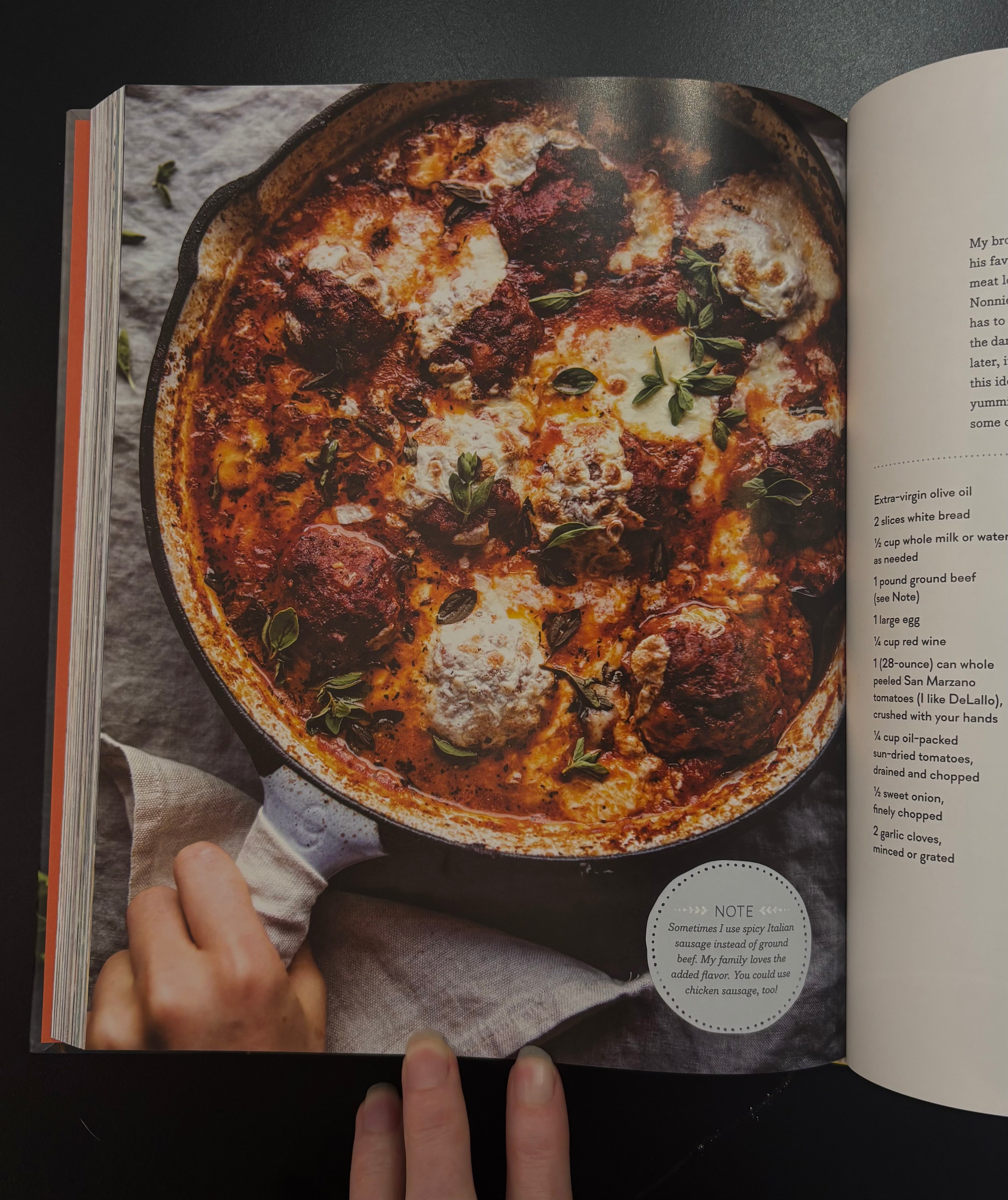 An open half baked harvest cookbook spread showing a large recipe page with a photo of a skillet pasta dish 