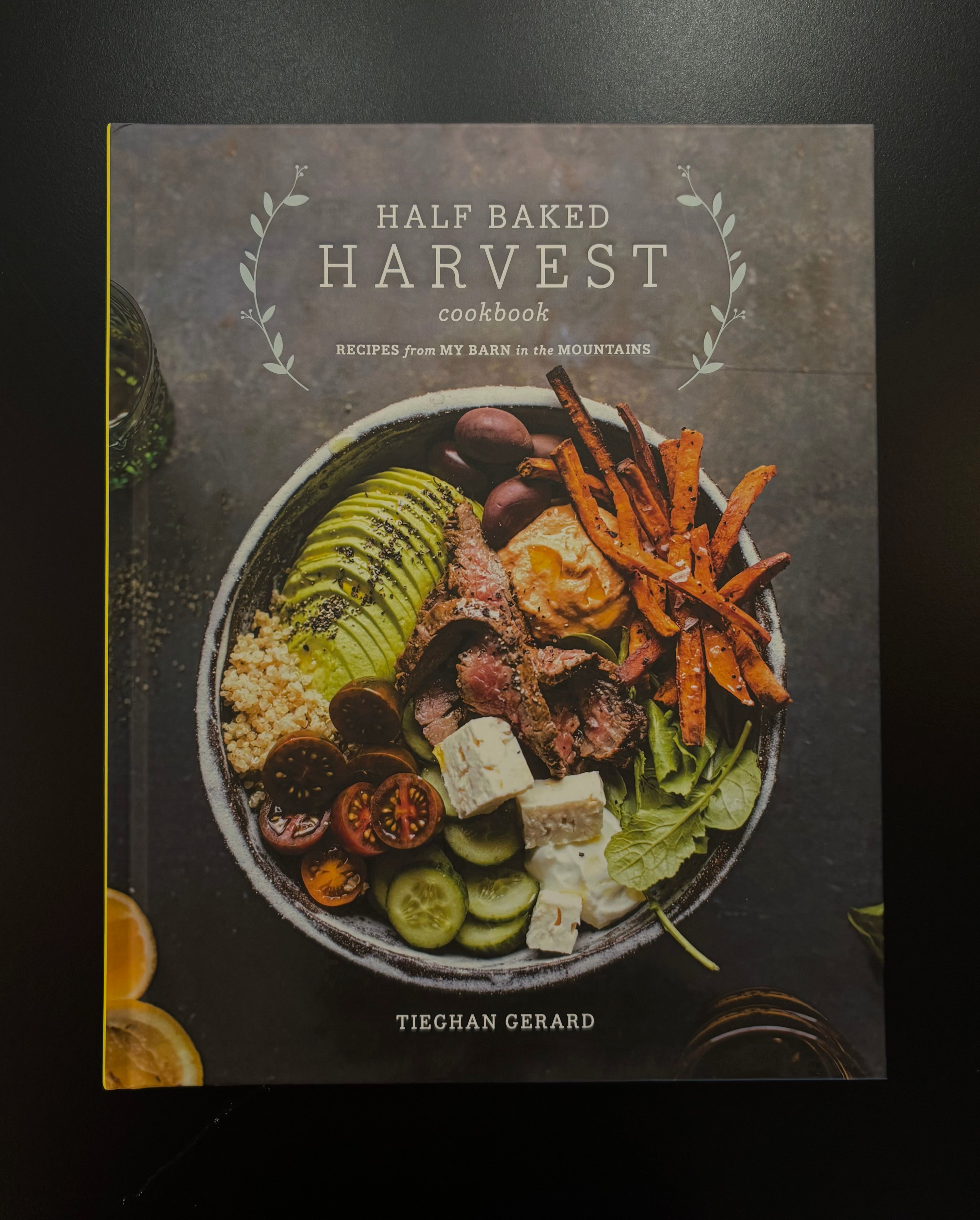 Image of front cover of the book 'Half Baked Harvest Cookbook' by Tieghan Gerard, featuring a colorful bowl of food