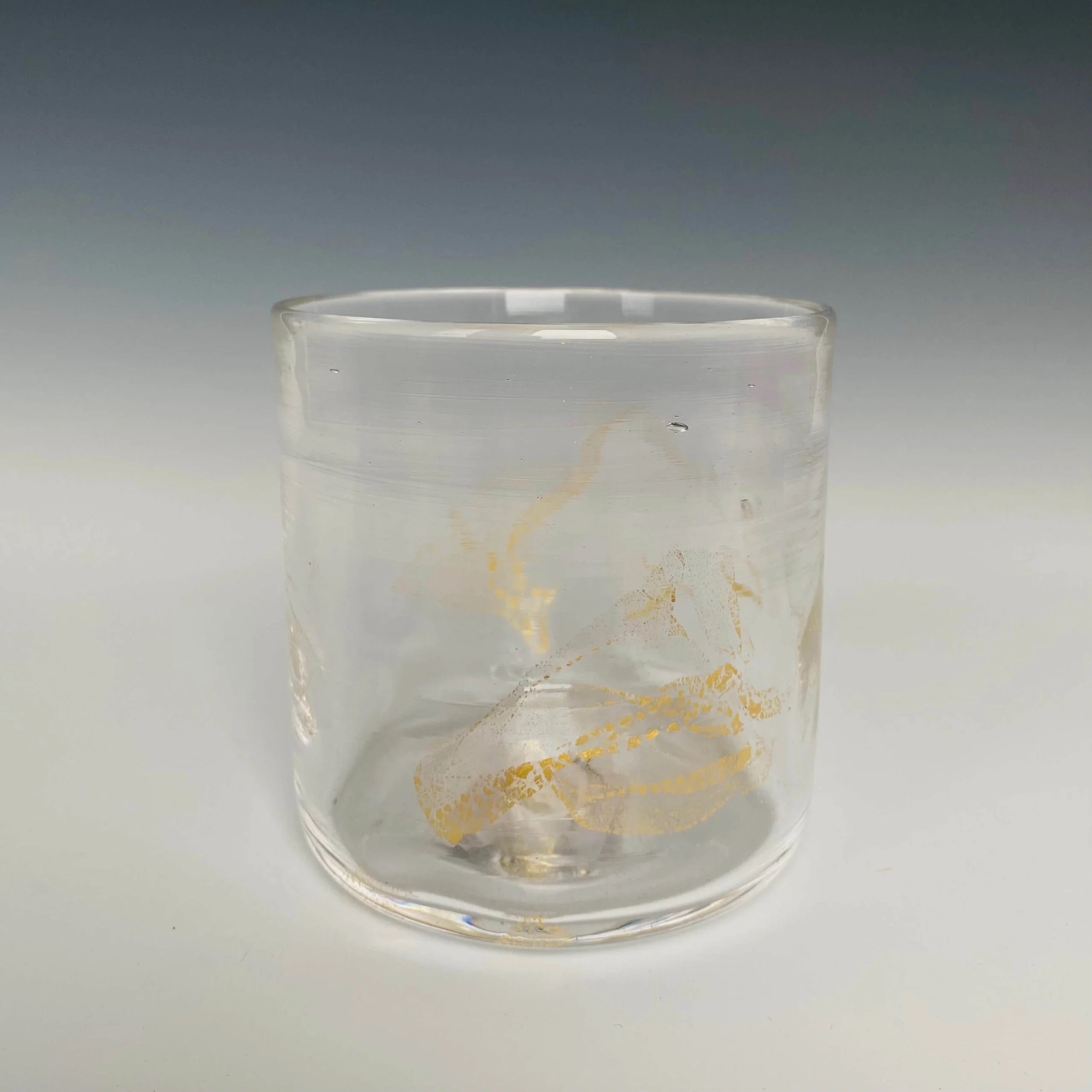 Image of a clear glass with 18k gold hand blown rocks glass made in USA by North Carolina glass artist John Shoemaker