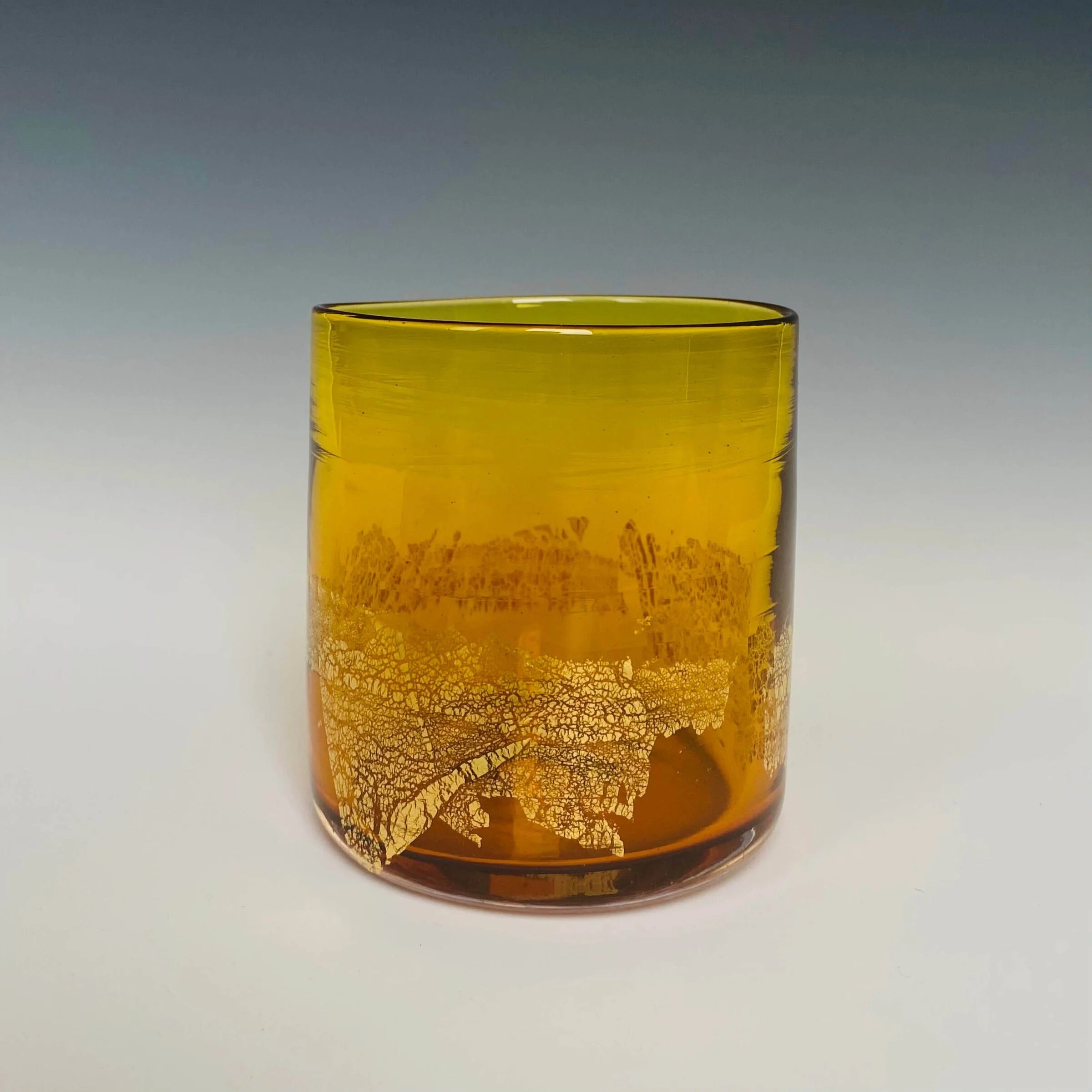 Image of a gold glass with 18k gold hand blown rocks glass made in USA by North Carolina glass artist John Shoemaker