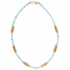 A aqua chalcedony necklace with cast bronze textured beads and bronze hook closure handmade by Texas artist Julie Cohn