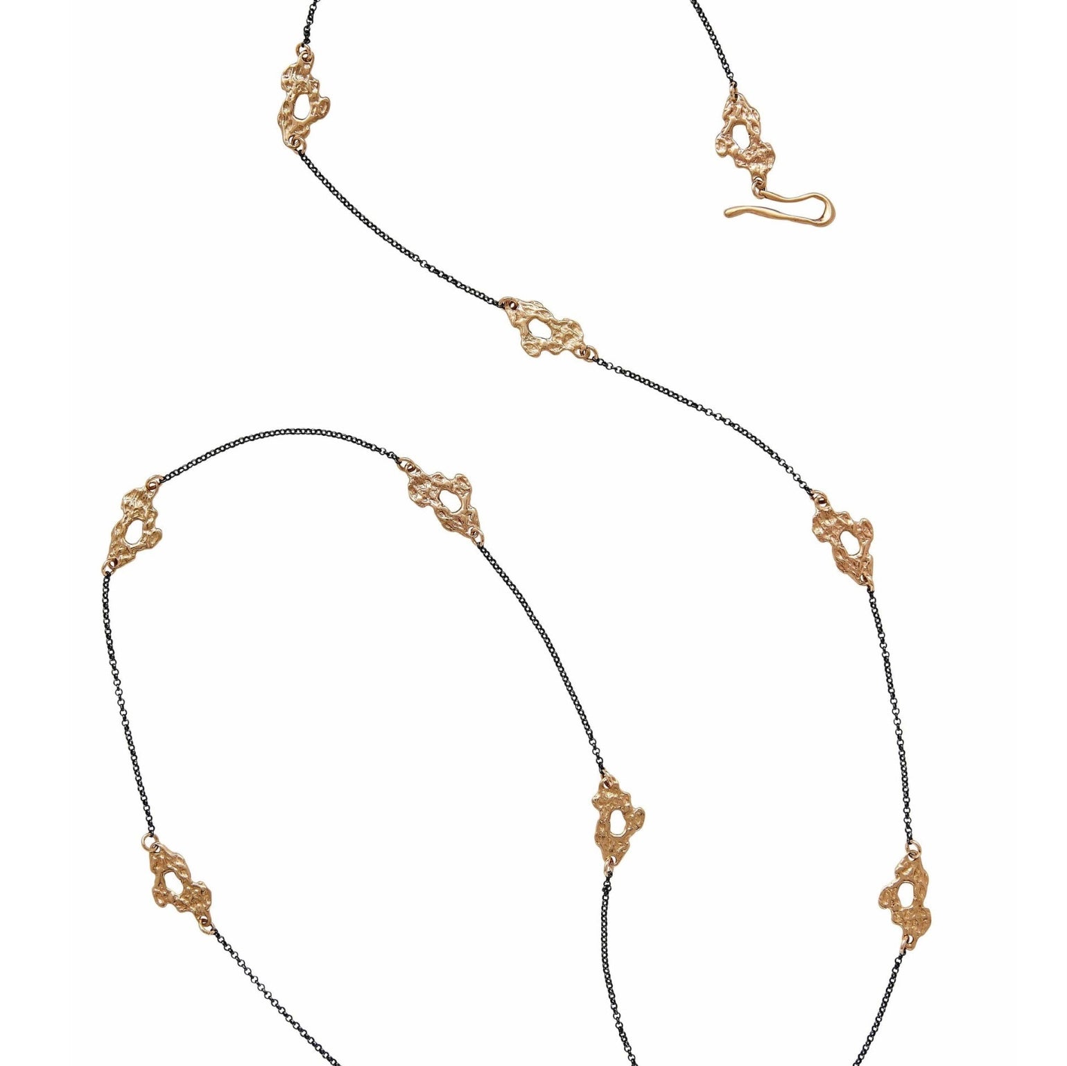 A long oxidized sterling silver chain necklace featuring a series of small bronze cast reef links handmade in USA by Texas artist Julie Cohn