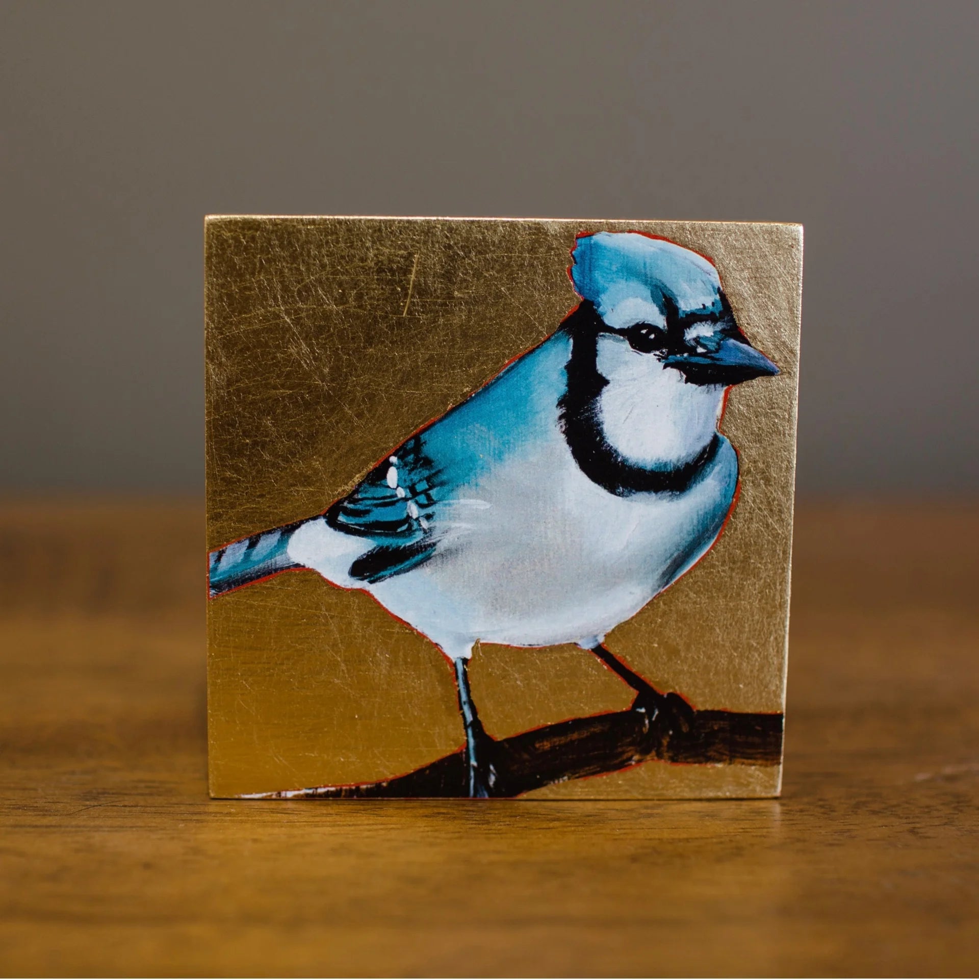 Image featuring a giclee by South Carolina artist Joseph Bradley with a Blue Jay and gold leaf.