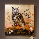 Image featuring South Carolina artist Joseph Bradley with an Eurasian Eagle Owl and gold leaf.