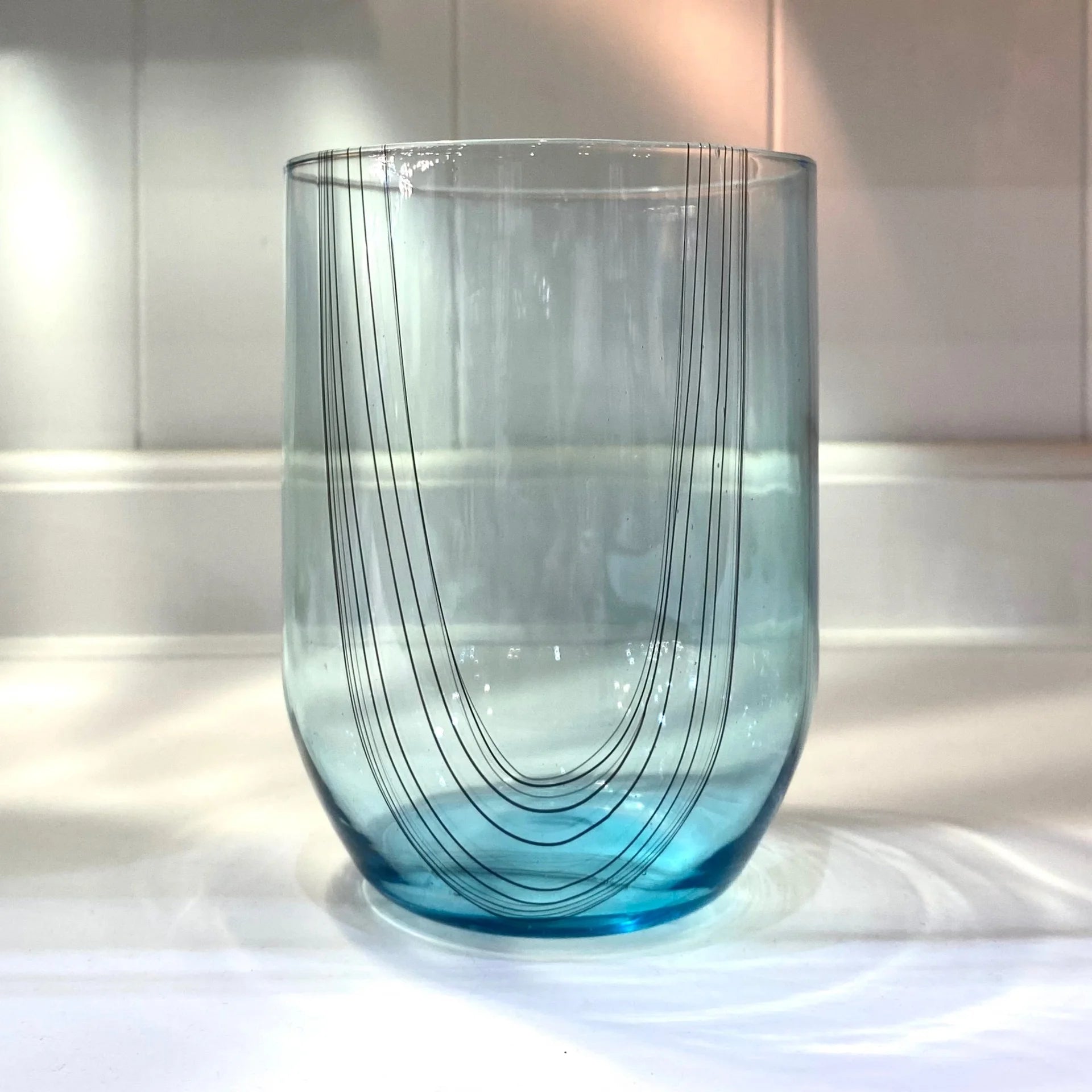 Teal hand blown Cocktail Glass from artist Kathryn Adams using classic Venetian glassblowing techniques made in USA