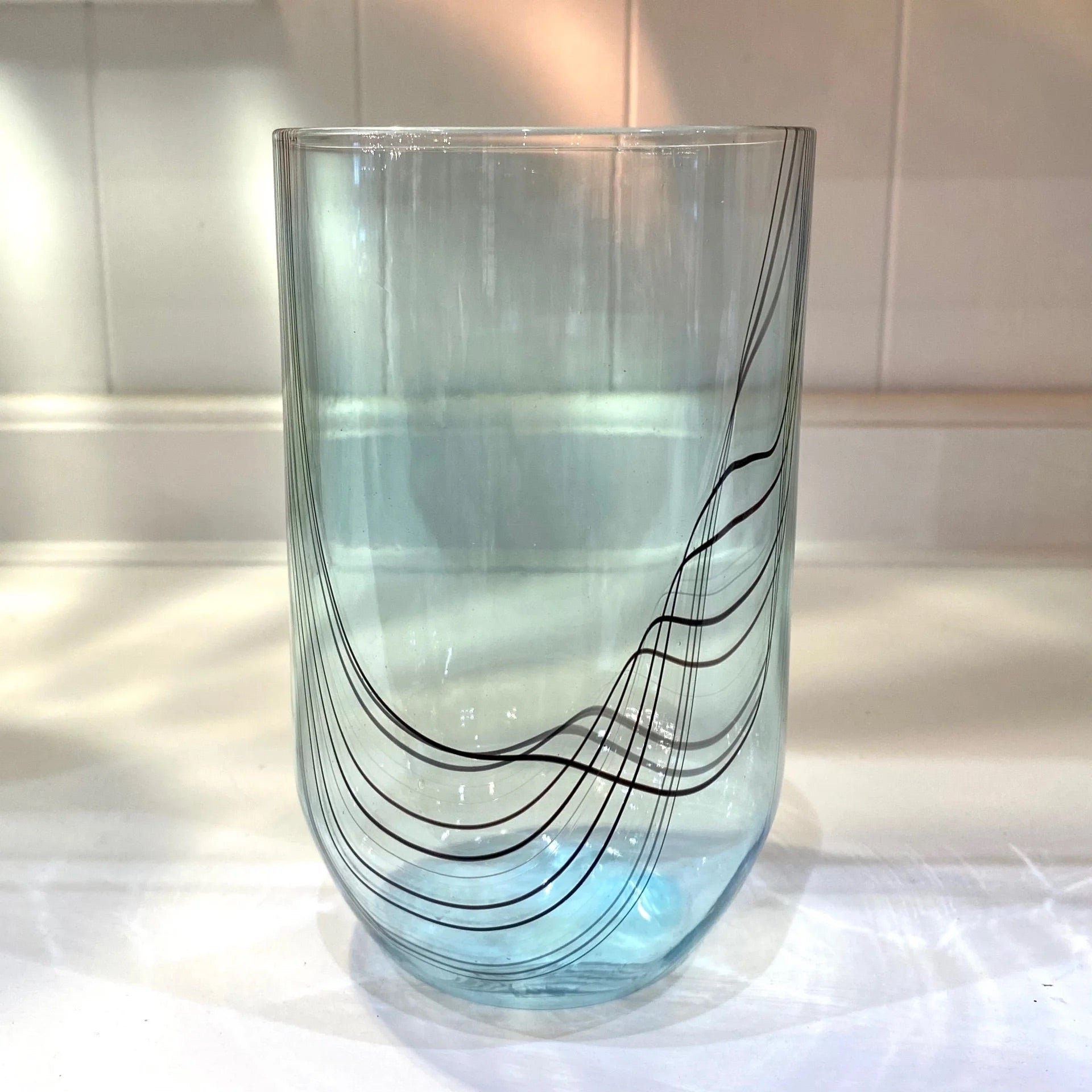 Teal hand blown tumbler Glass from artist Kathryn Adams using classic Venetian glassblowing techniques made in USA