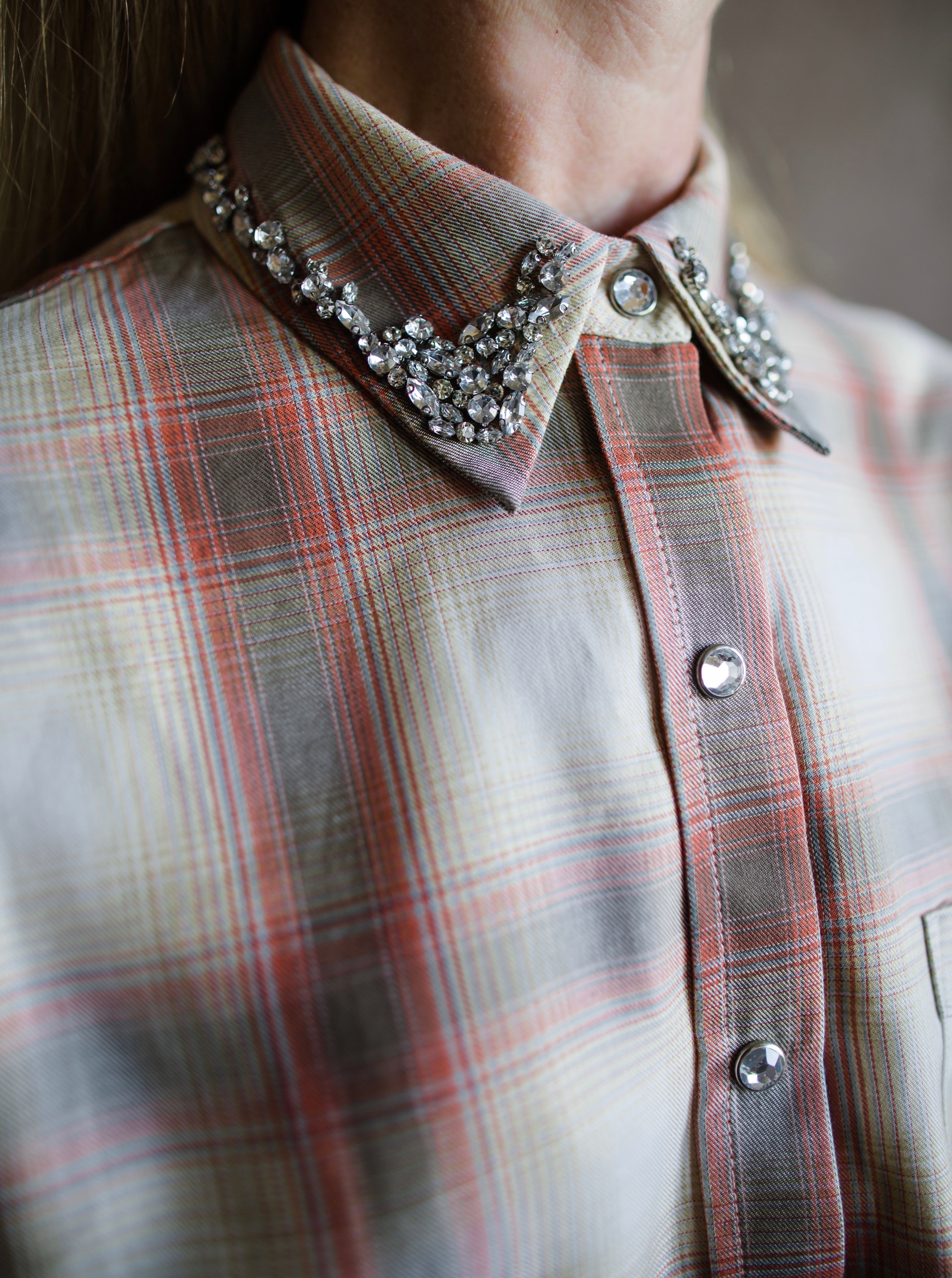 close up image of a woman wearing the le superbe grandpa plaid shirt with rhinestones