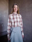 Image featuring a woman wearing le superbe grandpa plaid shirt with ulla johnson wool ruffle skirt