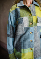 Image featuring a woman wearing the nirvana pendleton jacket by Le Superbe features a button front with flap pockets and a boxy fit.