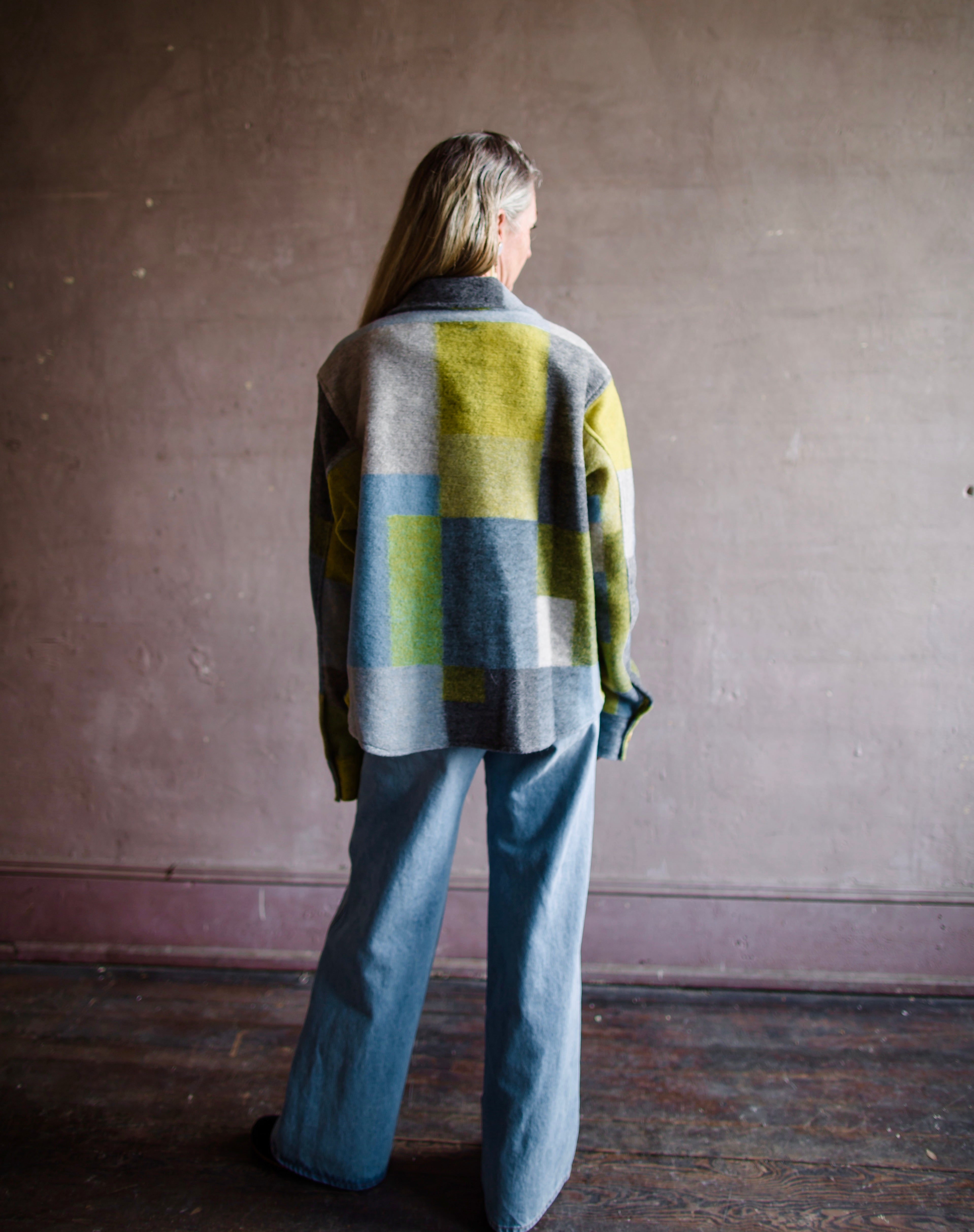 Image featuring a woman wearing the nirvana pendleton jacket by Le Superbe features a button front with flap pockets and a boxy fit.