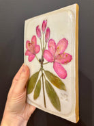A rectangular ceramic tile with botanical pressed pink rosebay rhododendron on cream clay by local NC artist