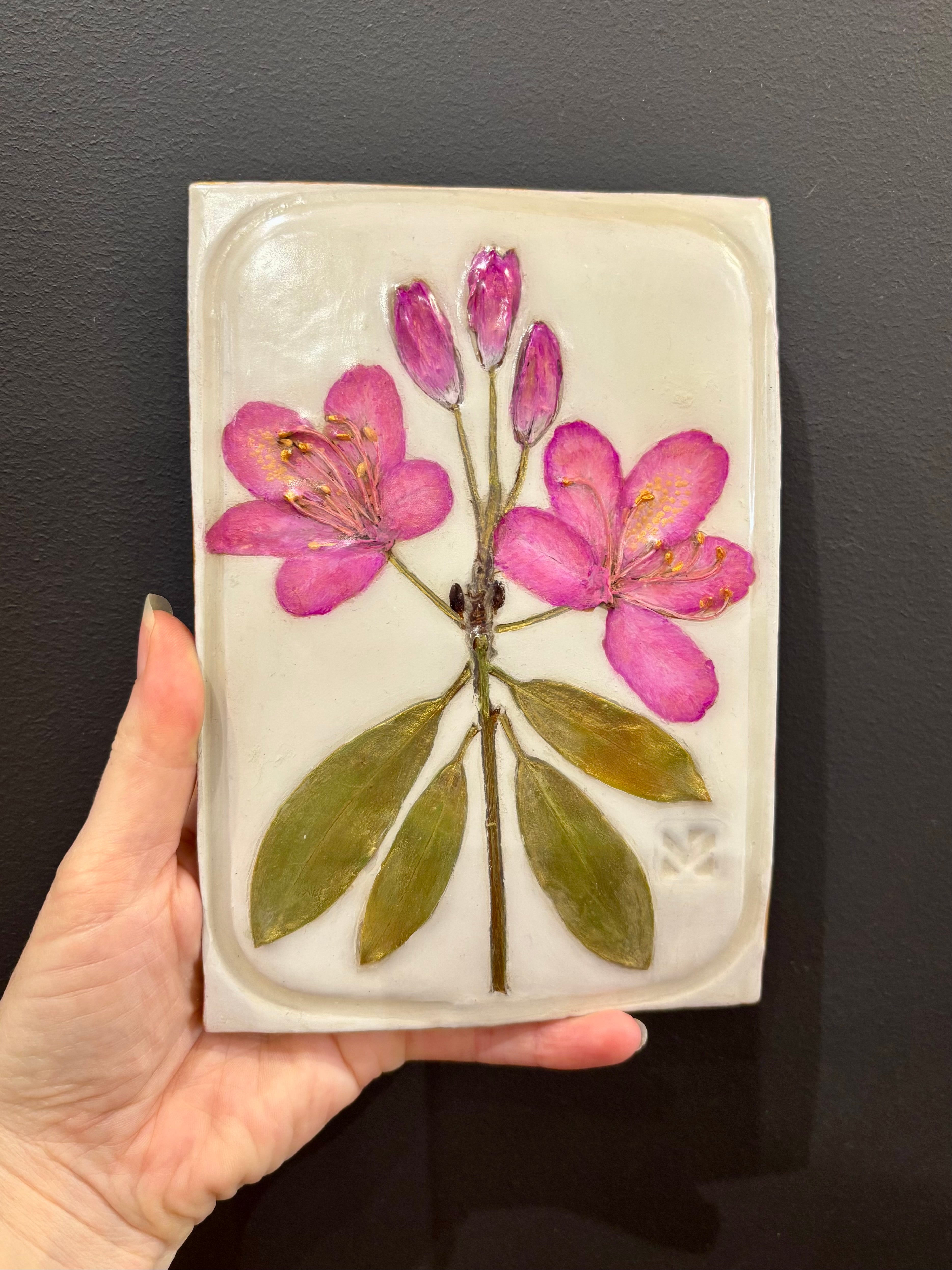 A rectangular ceramic tile with botanical pressed pink rosebay rhododendron on cream clay by local NC artist
