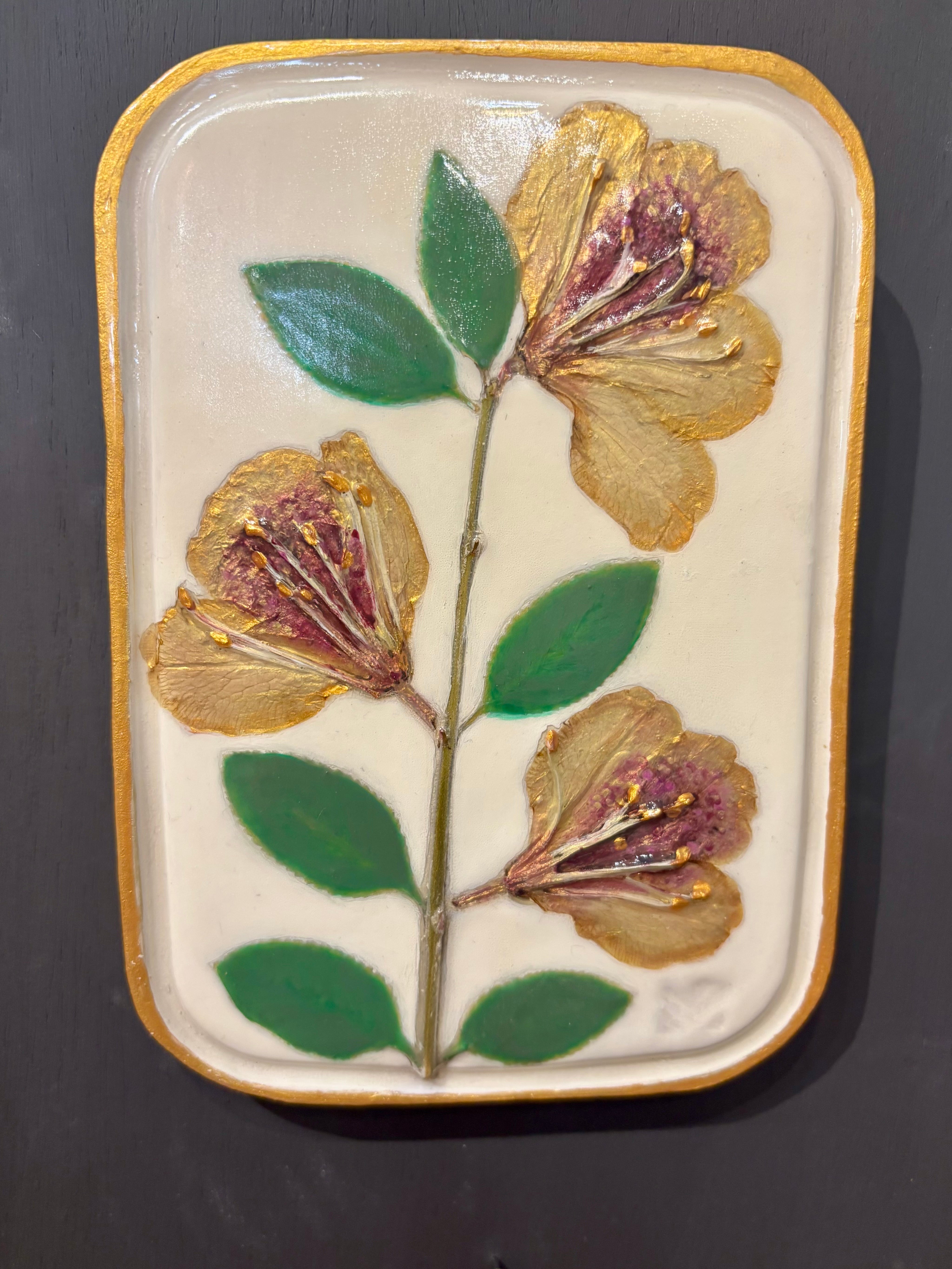 A rectangular ceramic tile with botanical pressed yellow sappora rhododendron on cream clay by local NC artist