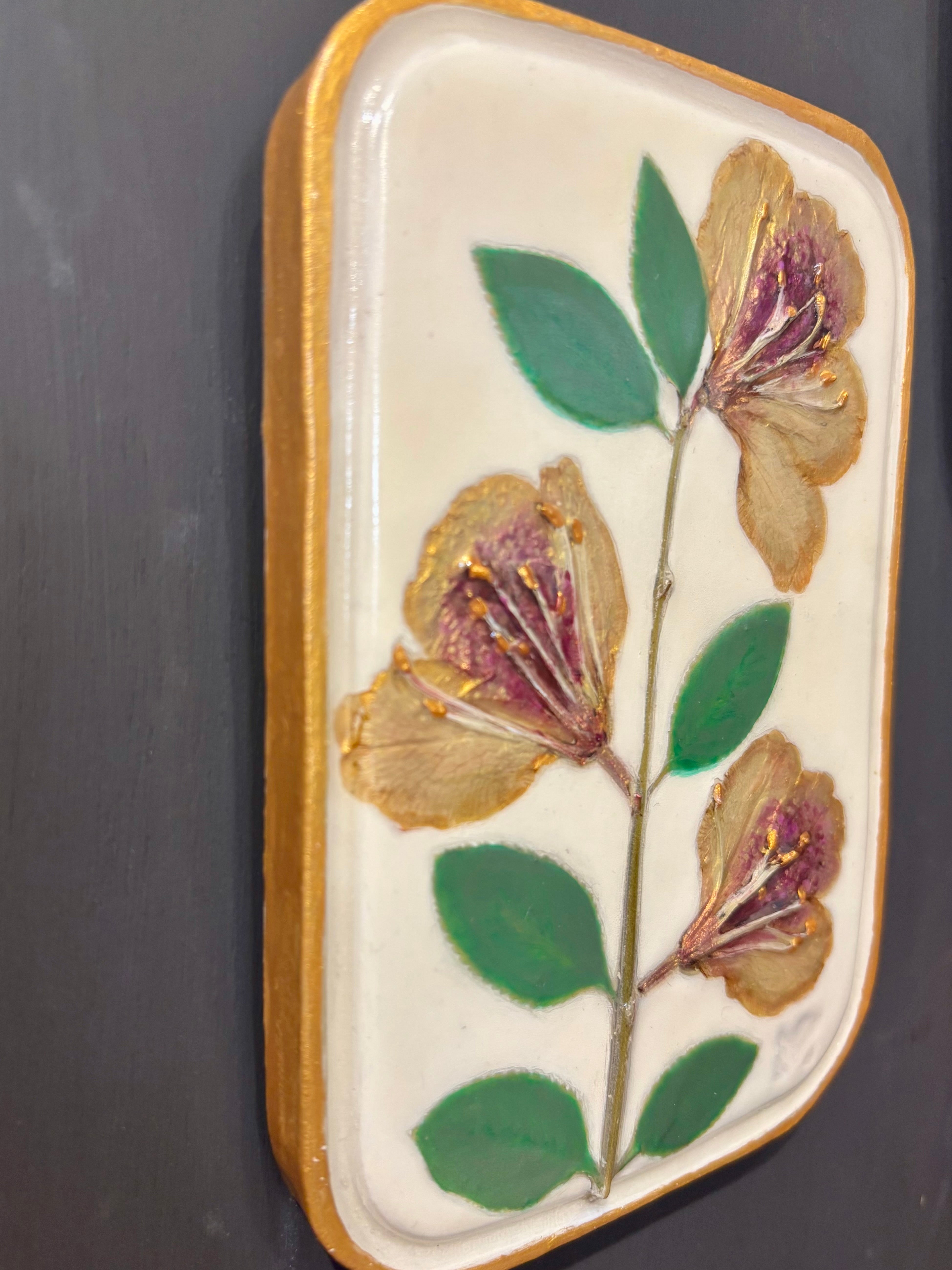 A rectangular ceramic tile with botanical pressed yellow sappora rhododendron on cream clay by local NC artist