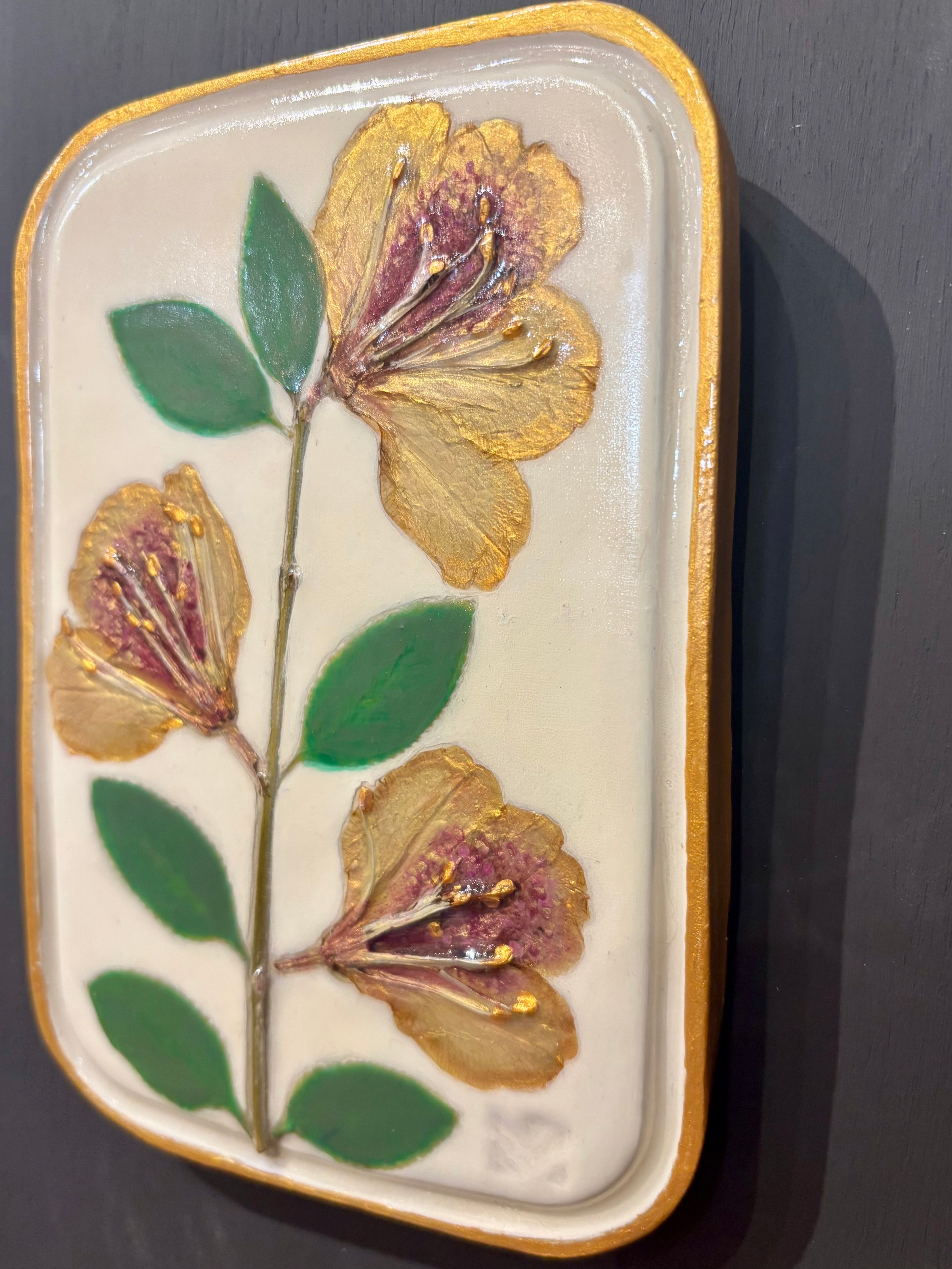 A rectangular ceramic tile with botanical pressed yellow sappora rhododendron on cream clay by local NC artist