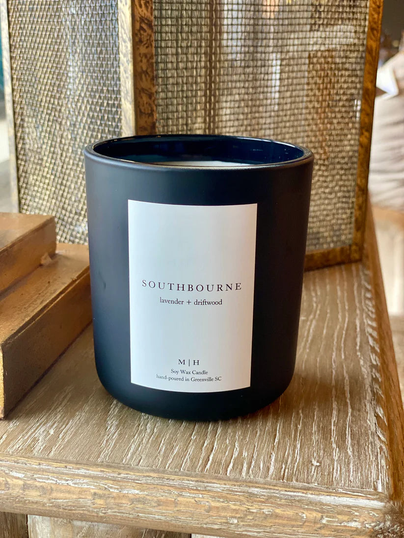 Image of the Southbourne candle  hand poured in Greenville South Carolina in a calming blend of lavender and driftwood crafted in a glass container with Soy Wax and a wood wick