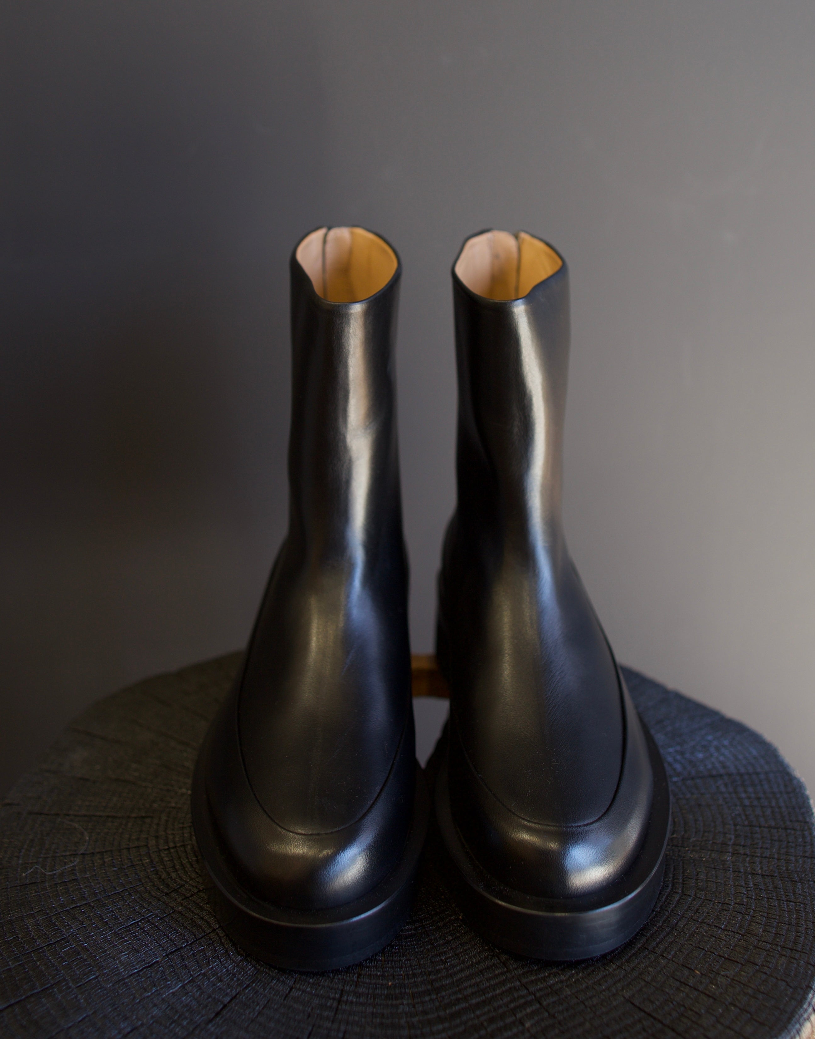 Image featuring The Marion Boot by Mansur Gavriel in black with a round toe, back zip closure and a chunky sole.