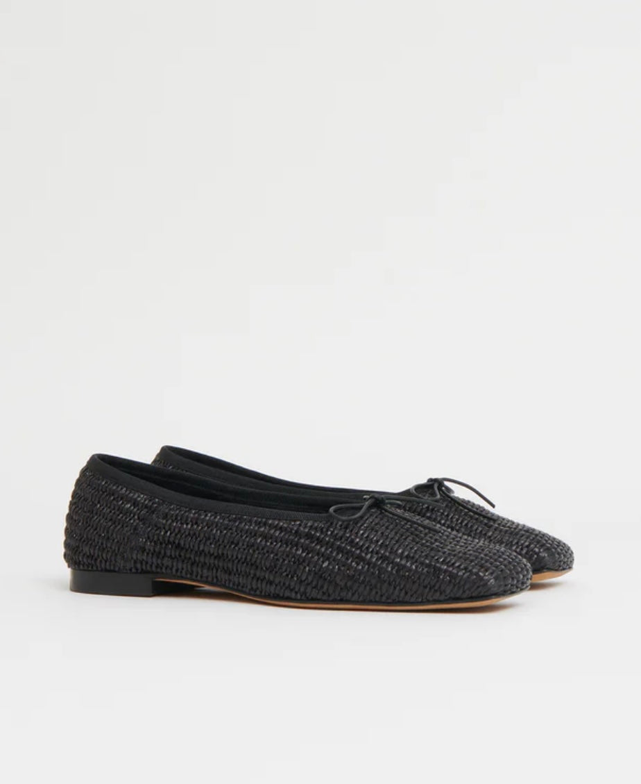 Pair of black woven raffia ballet flats with a square toe and bowtie by high-end footwear designer Mansur 