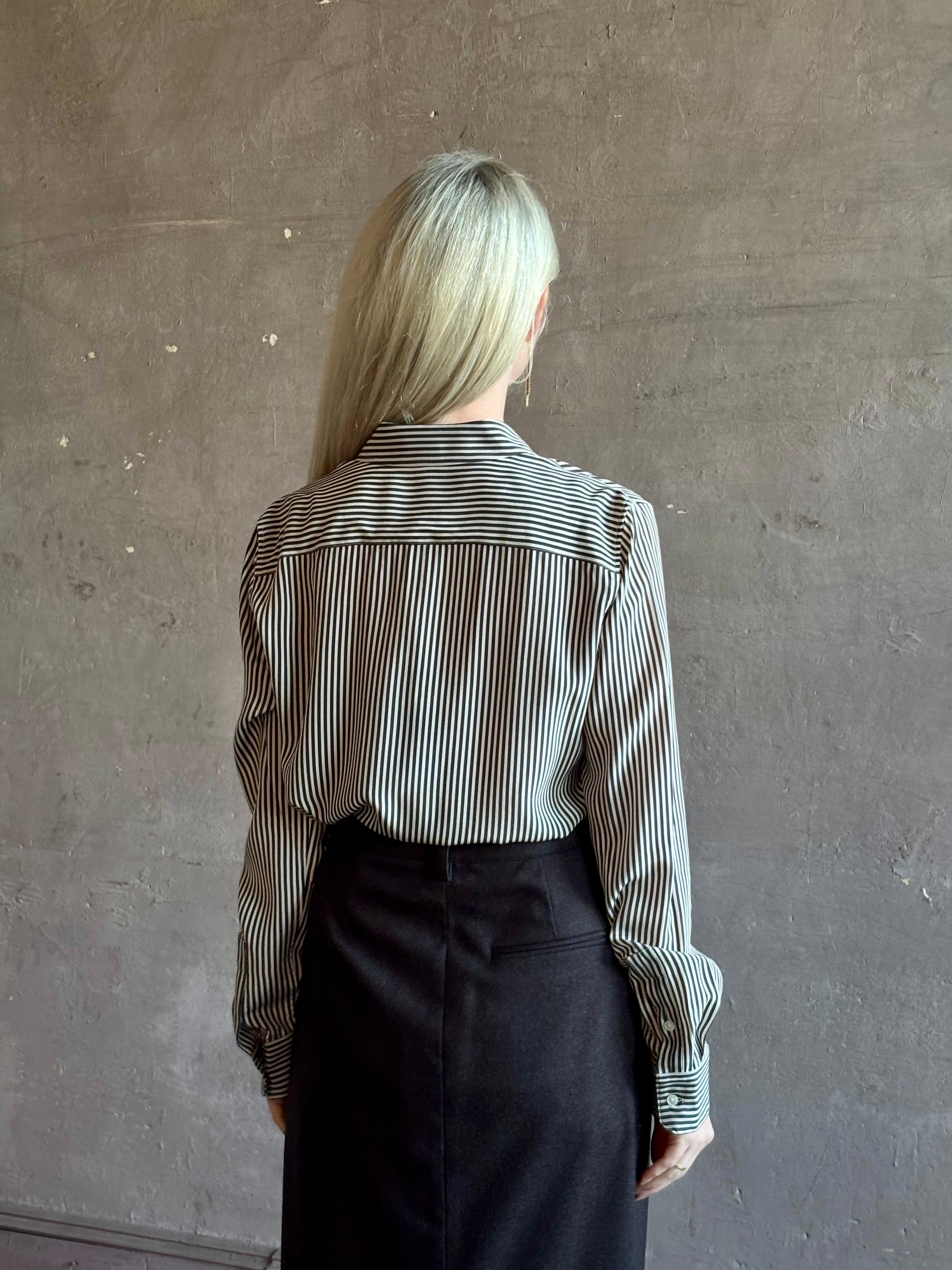 Mature woman wearing Nili Lotan Gaia Slim Silk Shirt in Dark Brown/Cream Stripe button front long sleeve blouse Made in the USA