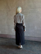 Mature woman wearing Nili Lotan Gaia Slim Silk Shirt in Dark Brown/Cream Stripe classic button front Made in the USA