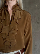 Mature woman wearing Nili Lotan's Lily Long sleeve Blouse Cognac silk delicate front ruffle Warm romantic American-made