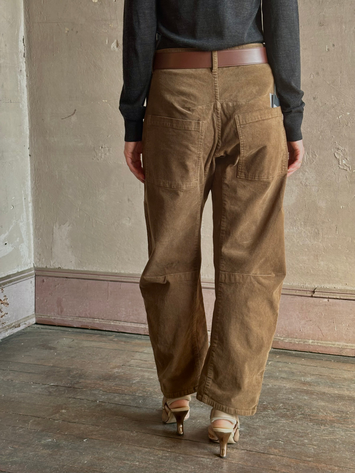 Mature woman in Nili Lotan's Shon hazel Pant fine corduroy barrel silhouette oversized pockets workwear-inspired 