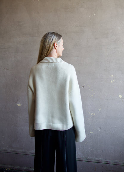 Image featuring a woman wearing this Ultra Luxe Cashmere Polo Sweater by Naadam in cream with a split neckline and collar in an oversized fit.