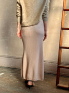 Close up of Mature woman wearing Naadam's Ribbed Maxi Skirt showing modern V pattern ribbing in a flattering  silhouette 