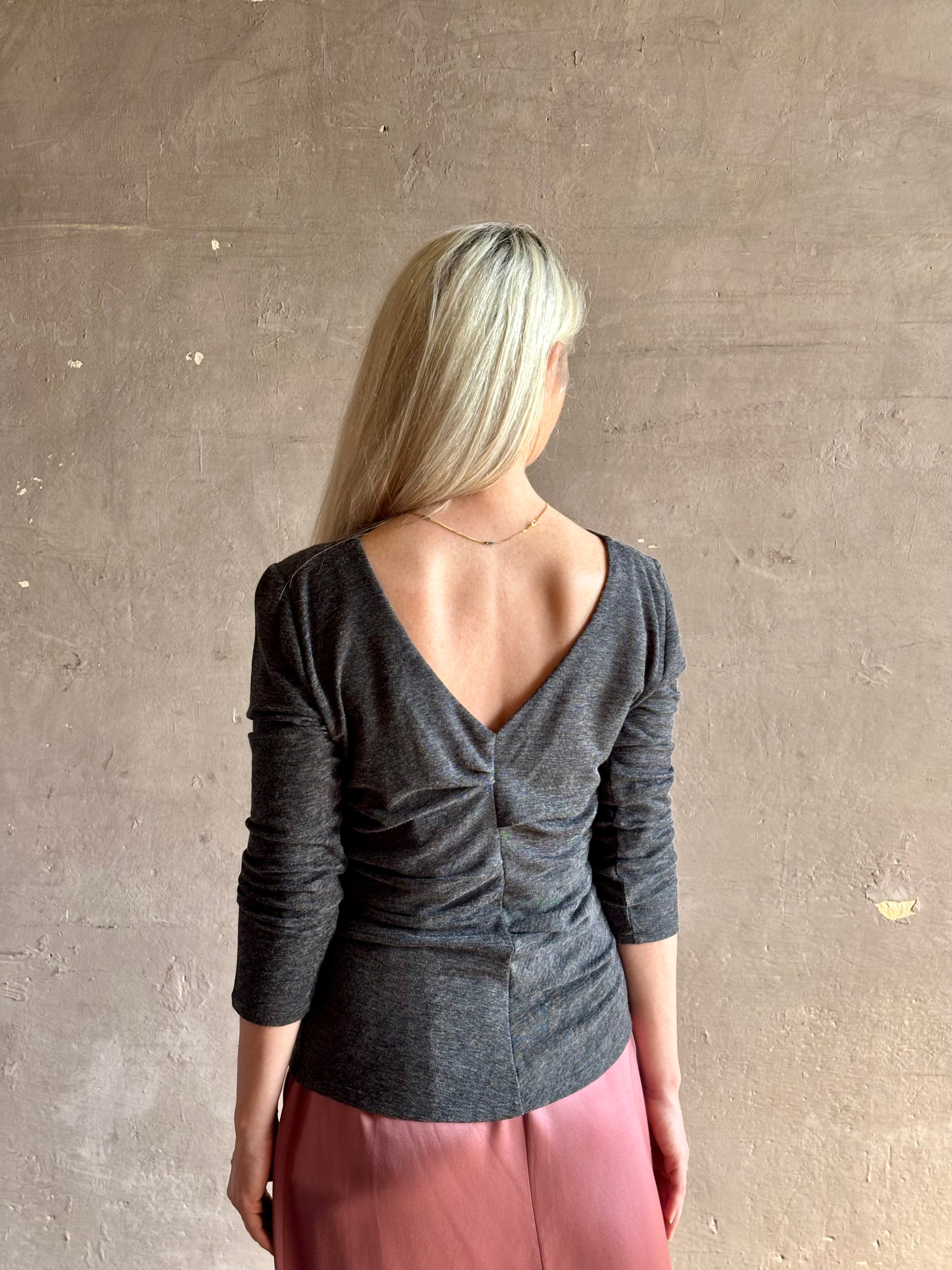 Woman wearing Proenza Schouler Blythe charcoal Top reversable long sleeves wool side ruching luxe draping
