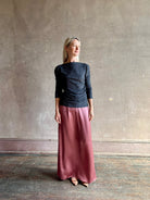 Woman wearing Proenza Schouler Blythe charcoal Top reversable long sleeves wool side ruching luxe draping