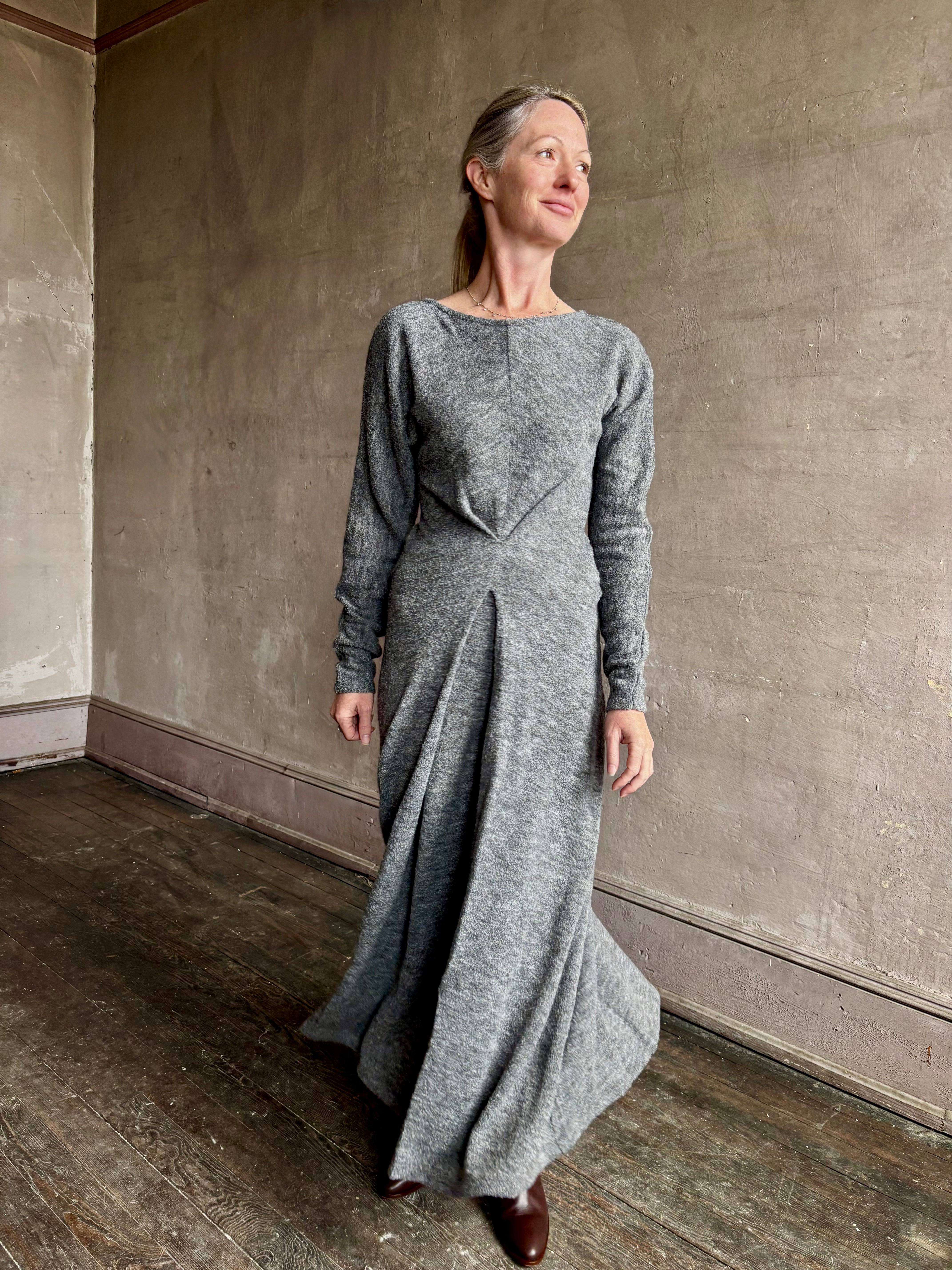 Image of mature woman wearing Proenza Schouler Sai maxi Dress  with a round neckline, long sleeves and tuck-pleated front detailed 