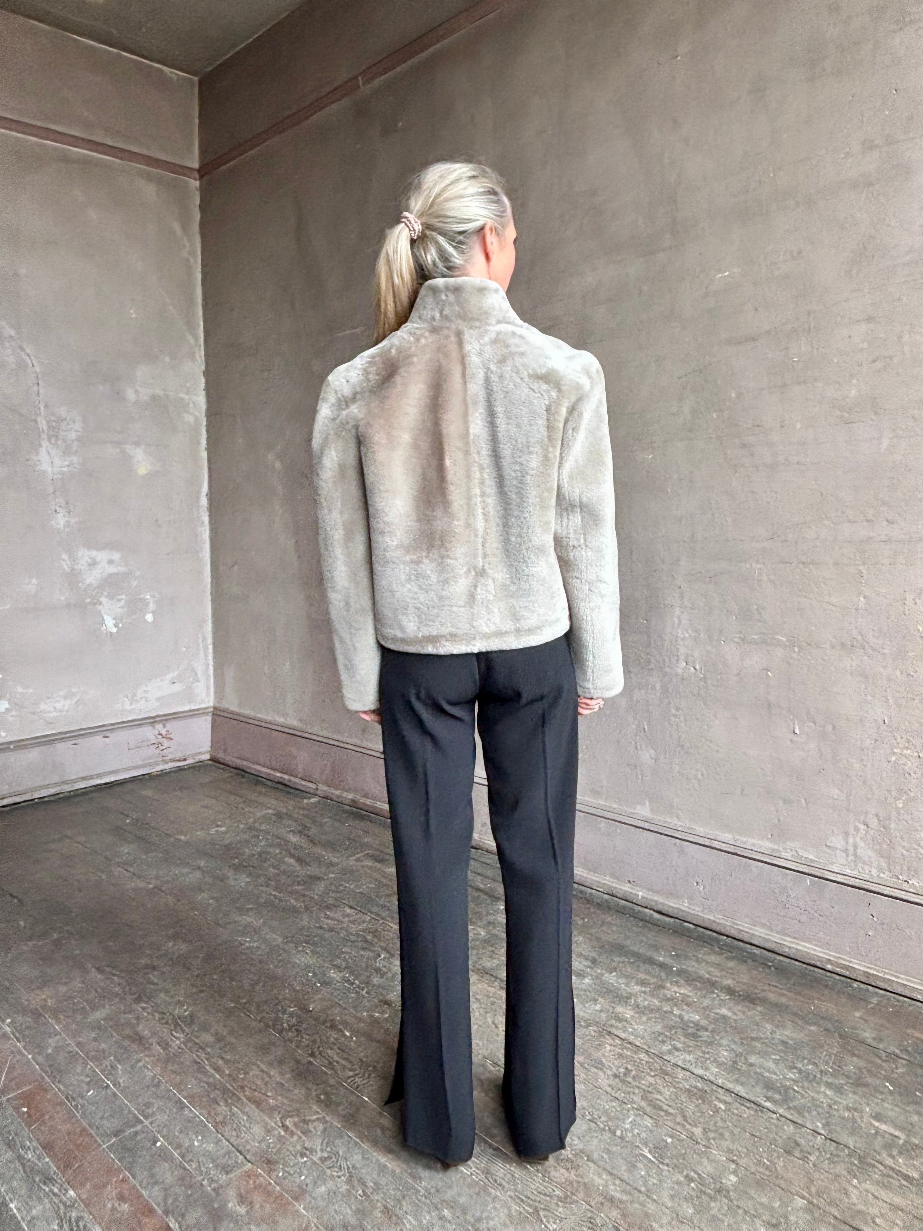 Image of a mature woman wearing Proenza Schouler Scarlett shearling jacket with a zip front and pockets in the perfect mid hip length