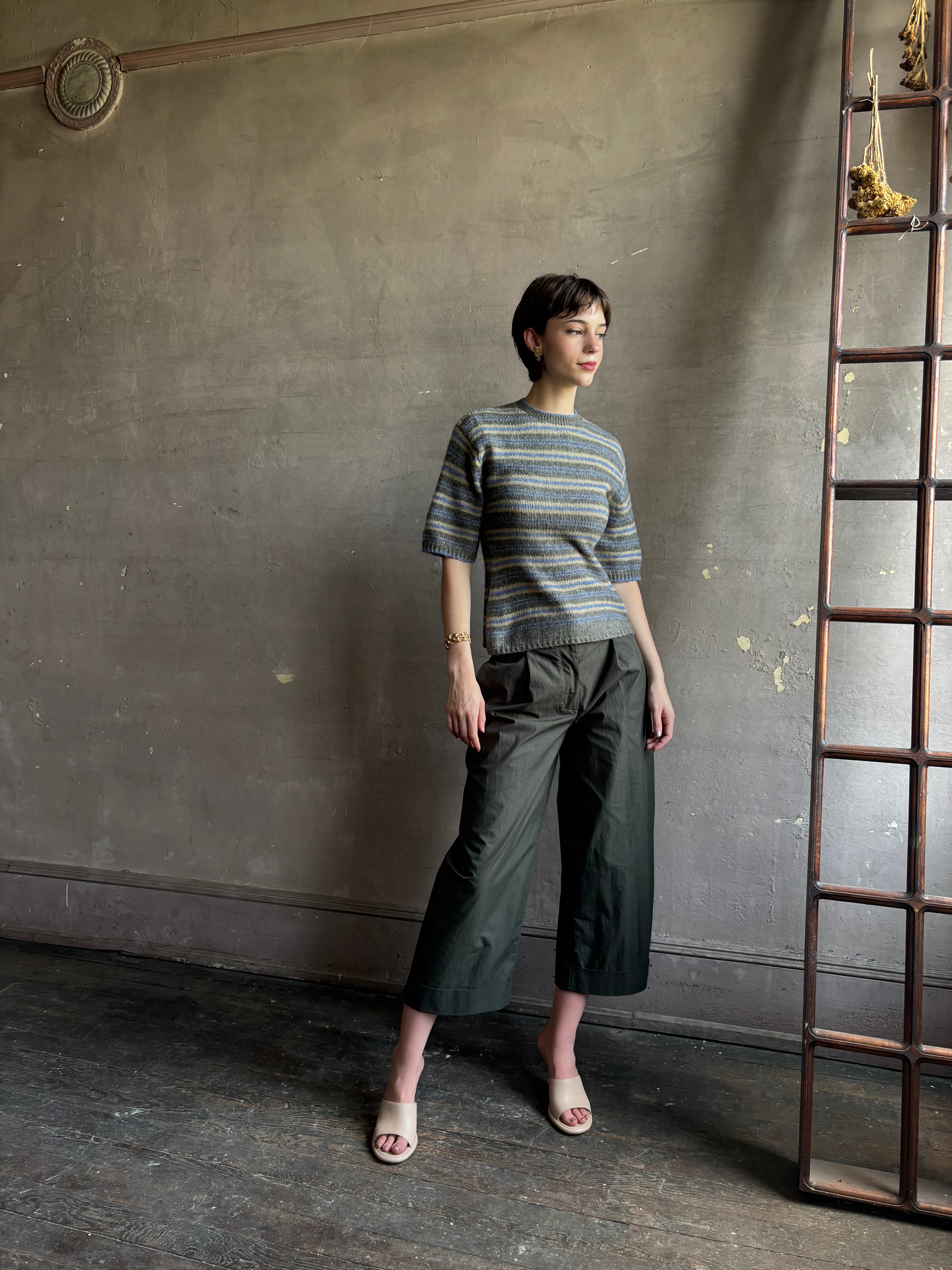 woman wearing Proenza Schoulder Dana sweater with short-sleeve knit top with blue, gray, and beige horizontal stripes 