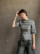luxury brand Proenza Schoulder Dana sweater with short-sleeve knit top with blue, gray, and beige horizontal stripes 