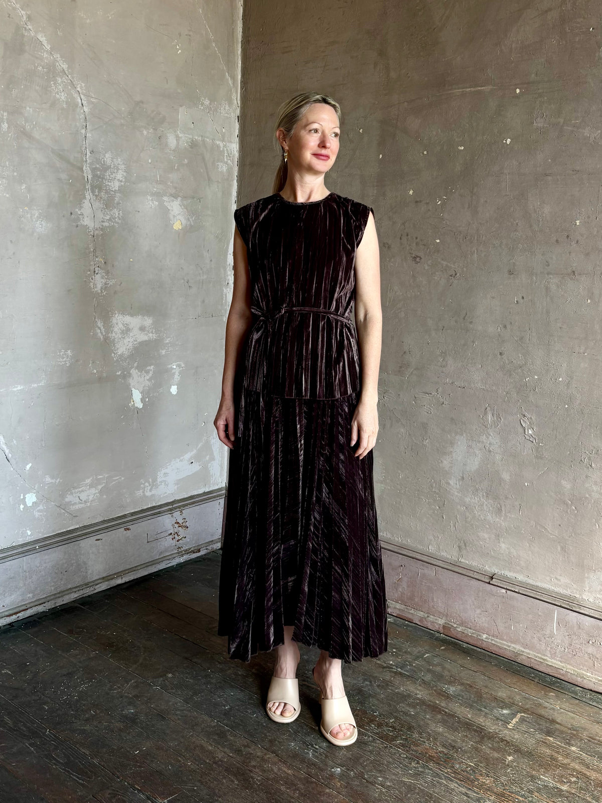 Mature woman wearing Proenza Schouler White Label Daphne crushed velvet Skirt A-line broomstick pleating occasion-ready 