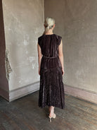 Mature woman wearing Proenza Schouler White Label Daphne crushed velvet Skirt A-line broomstick pleating occasion-ready 