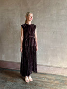 Mature woman wearing Proenza Schouler White Label Daphne crushed velvet Skirt A-line broomstick pleating occasion-ready 