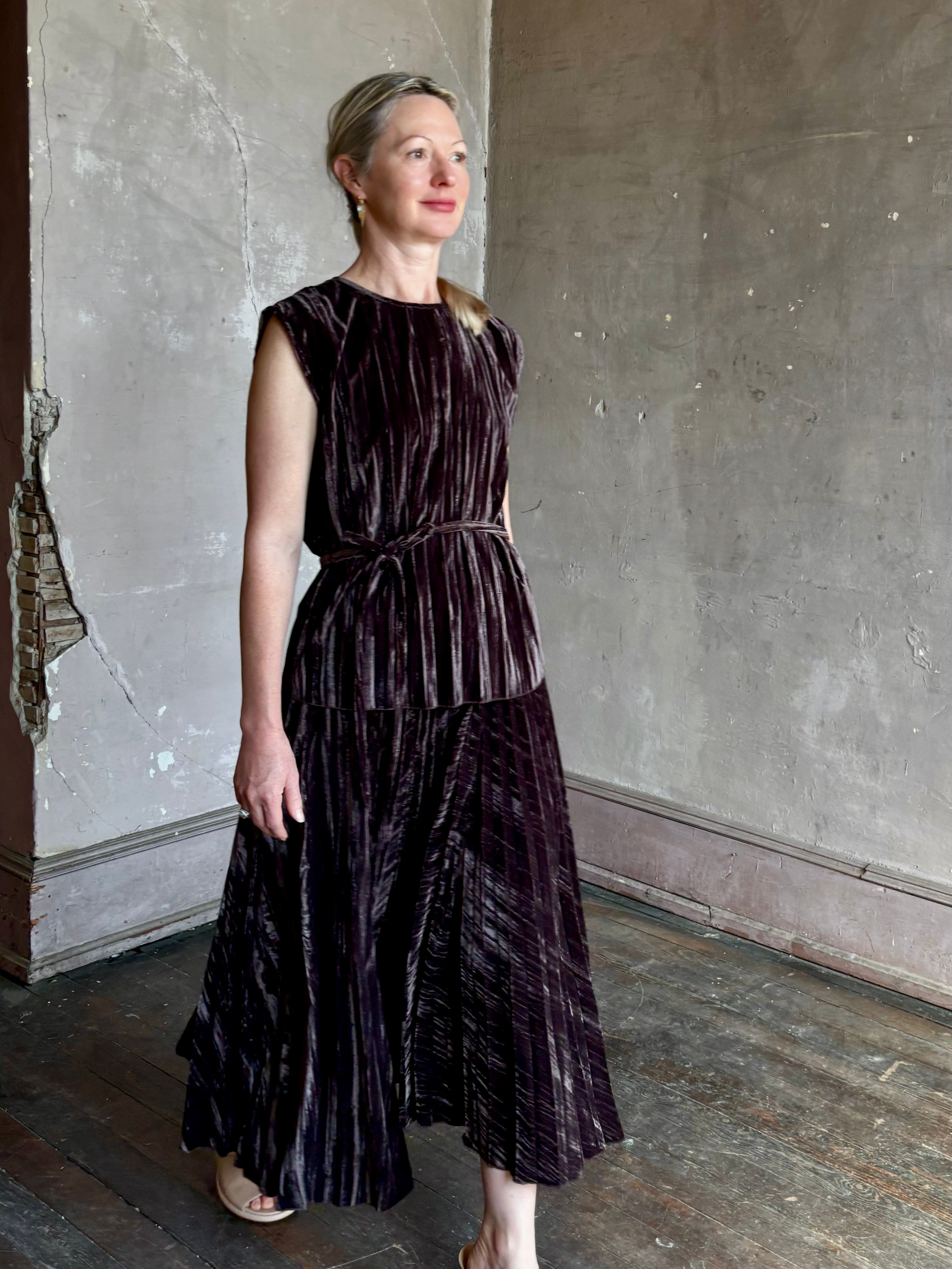 Mature woman wearing Proenza Schouler White Label Daphne crushed velvet Skirt A-line broomstick pleating occasion-ready 