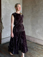 Mature woman wearing Proenza Schouler White Label Daphne crushed velvet Skirt A-line broomstick pleating occasion-ready 