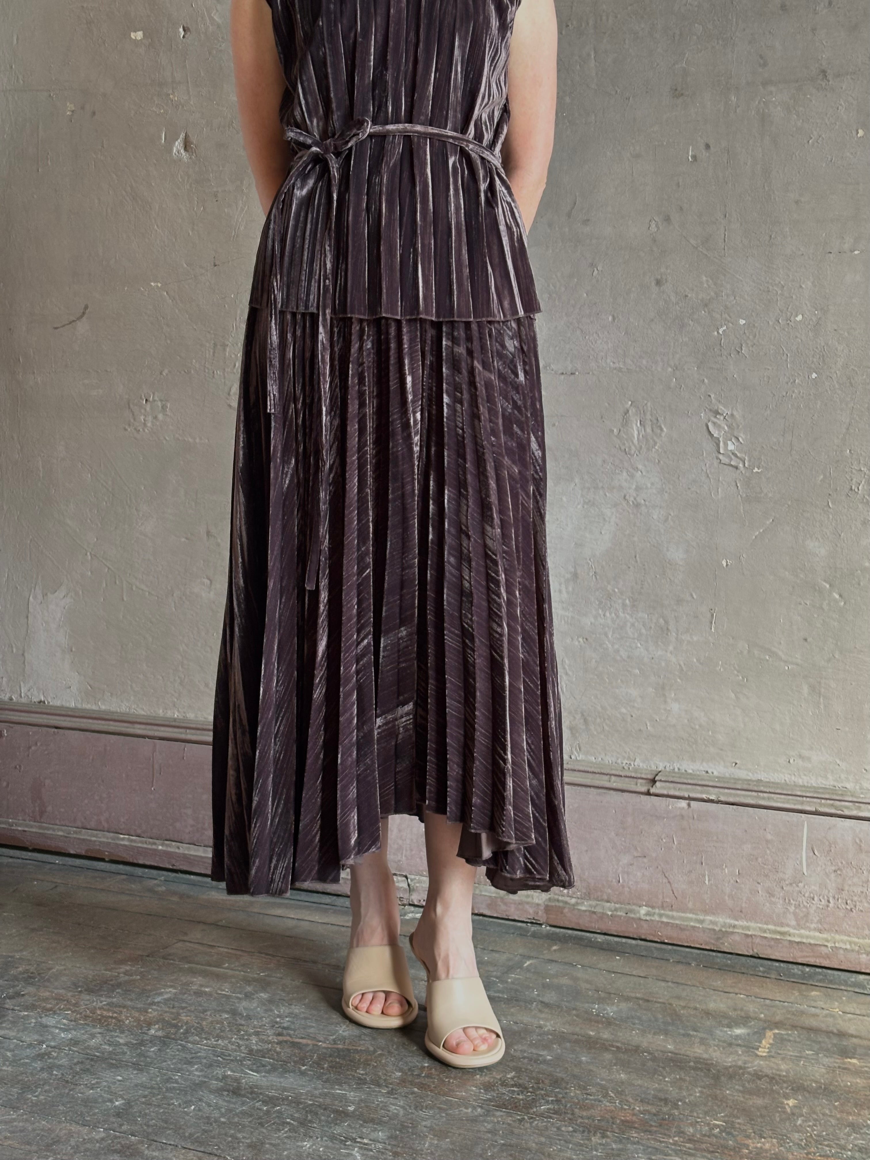 Mature woman wearing Proenza Schouler White Label Daphne crushed velvet Skirt A-line broomstick pleating occasion-ready 