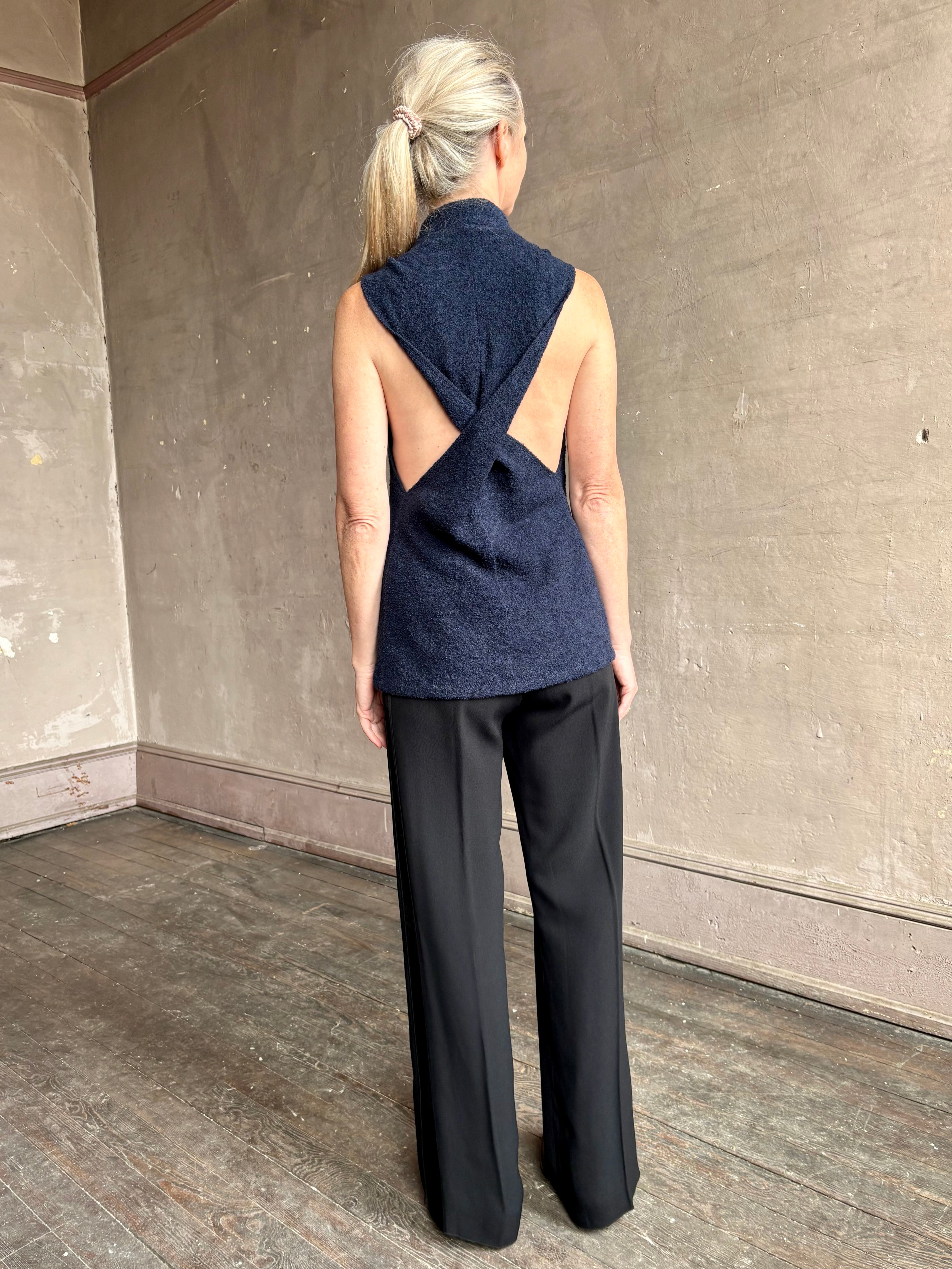 Image of mature woman wearing proenza schouler cynthia sleeveless top in a boucle texture and a beautifully designed back detailing