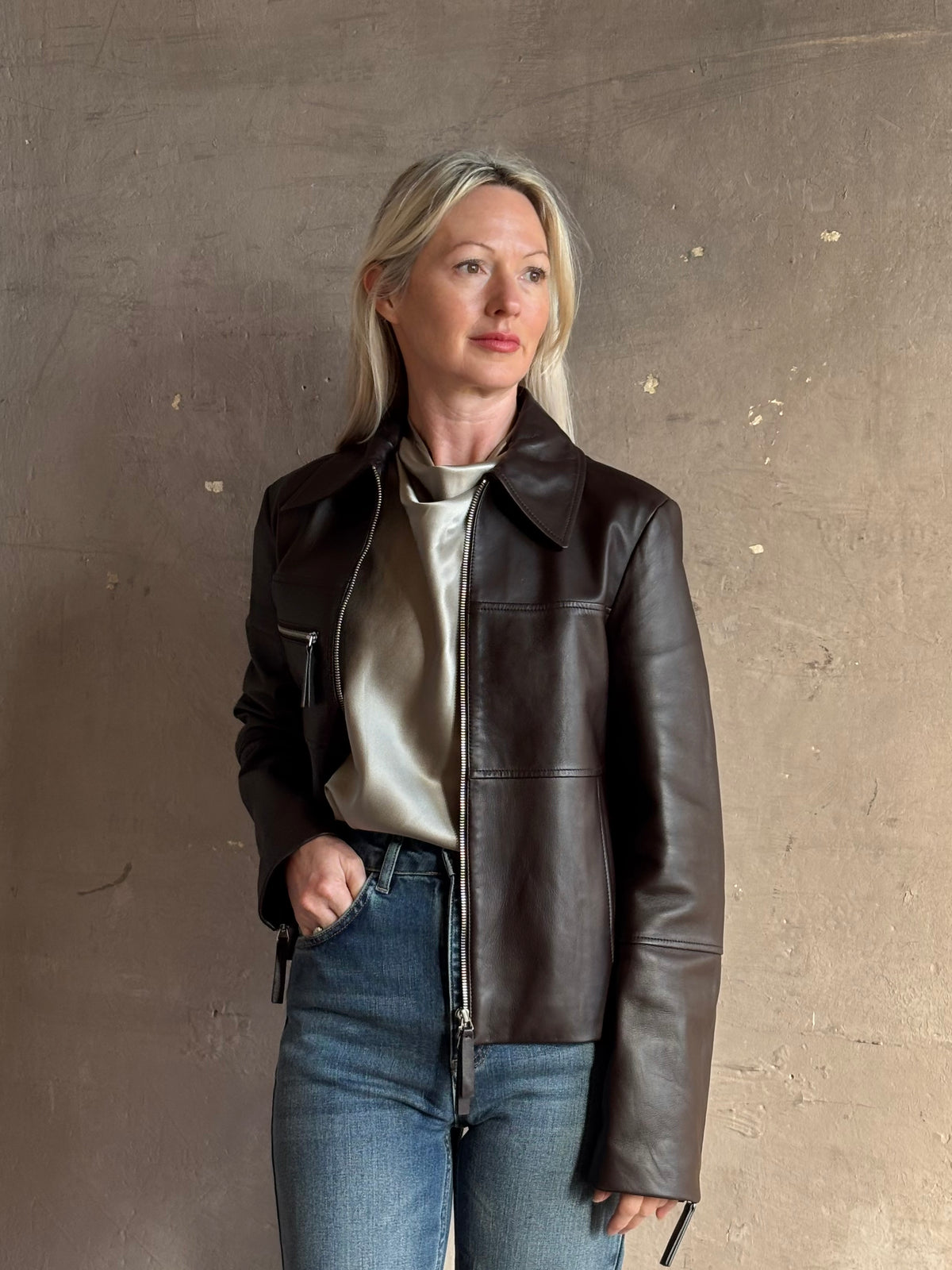 Proenza Schouler’s White Label Annabel Leather Jacket in Chocolate Brown: 100% lambskin biker with a two-way zip and sleeve zips. Supple, architectural