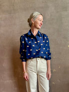 mature woman wearing designer Rachel Comey navy silk Lilo button down long sleeve contemporary heart print 