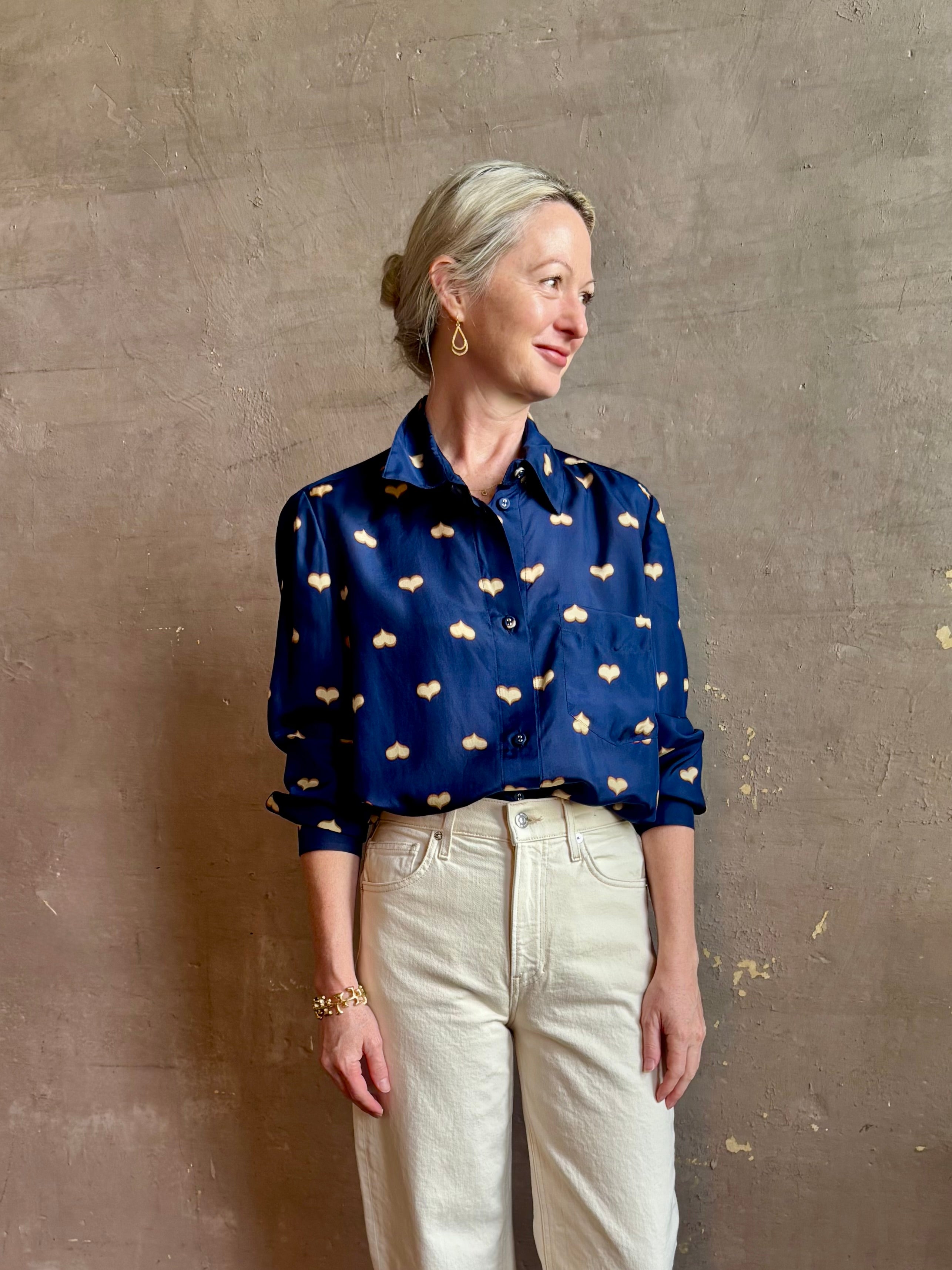 mature woman wearing designer Rachel Comey navy silk Lilo button down long sleeve contemporary heart print 